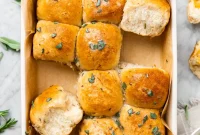 Irresistible Vegan Cheesy Garlic Dinner Rolls with Fresh Herbed Plant Butter