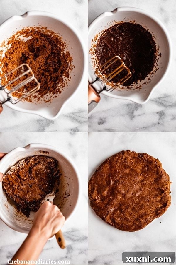 Close-up of freshly baked gingerbread house pieces on parchment paper, ready for assembly