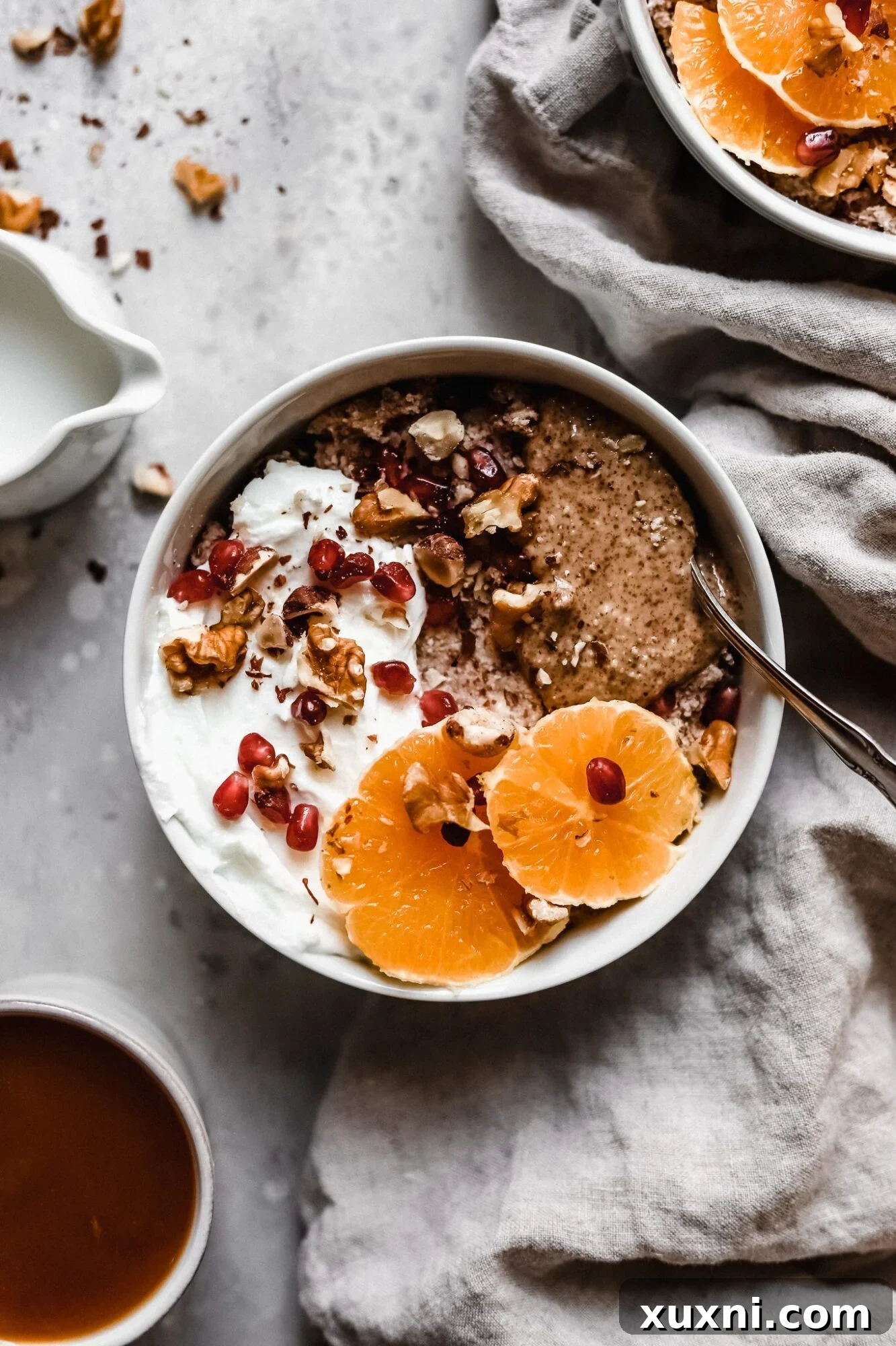 A cozy bowl of vegan grain-free hot cereal with a mug of coffee, perfect for a Whole30 breakfast.