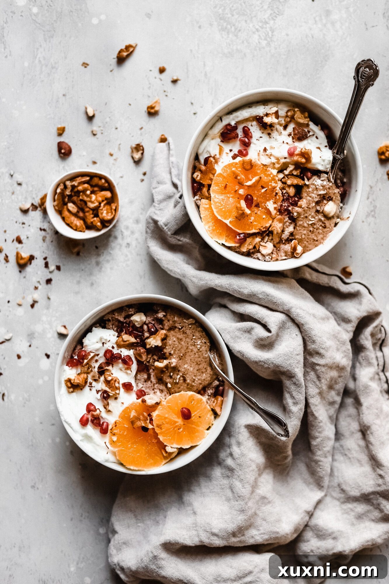 Two bowls of Whole30 compliant hot cereal, ready for a healthy plant-based breakfast.