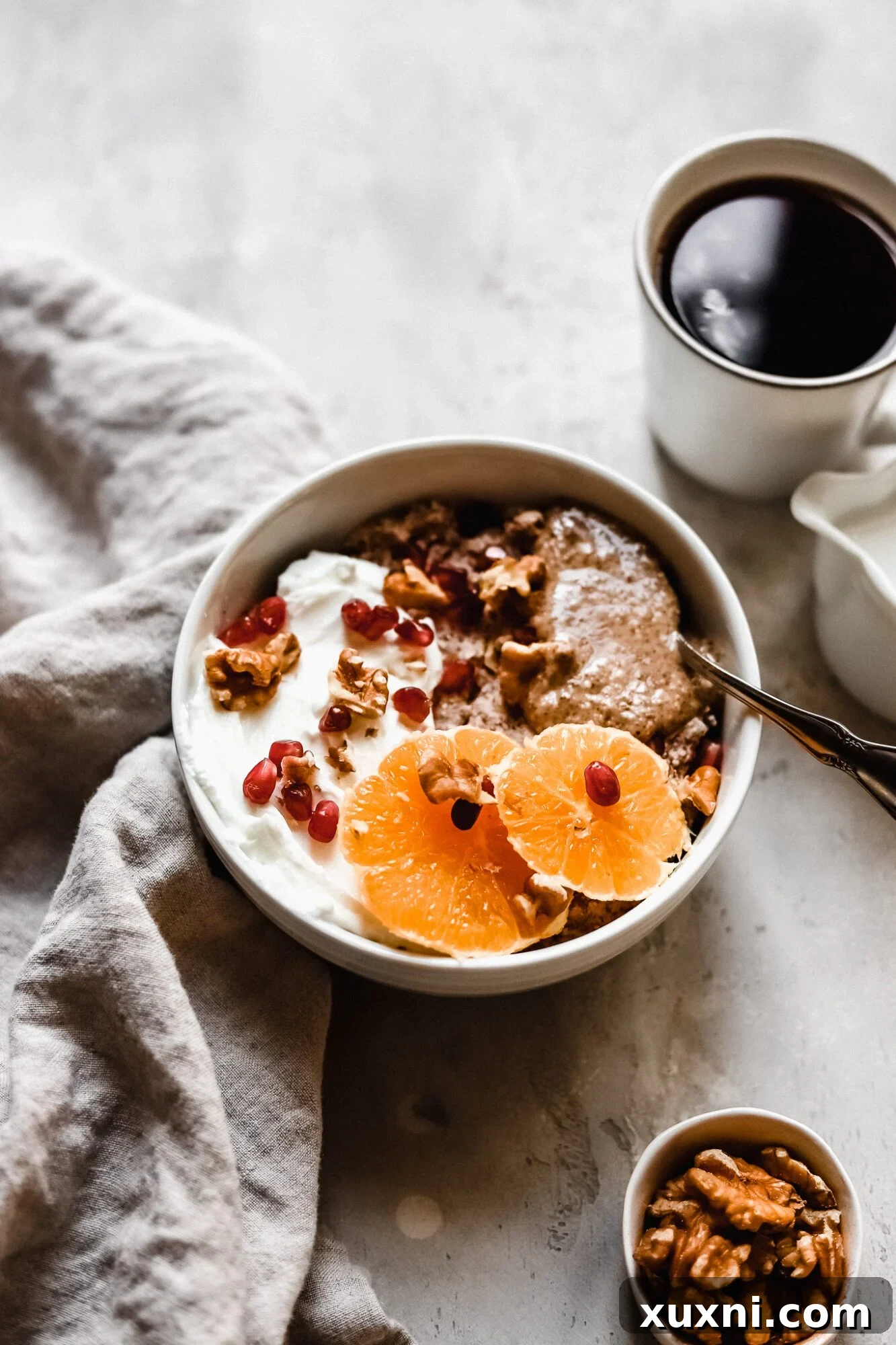 A bowl of grain-free hot cereal served with a side of coffee for a perfect Whole30 breakfast.