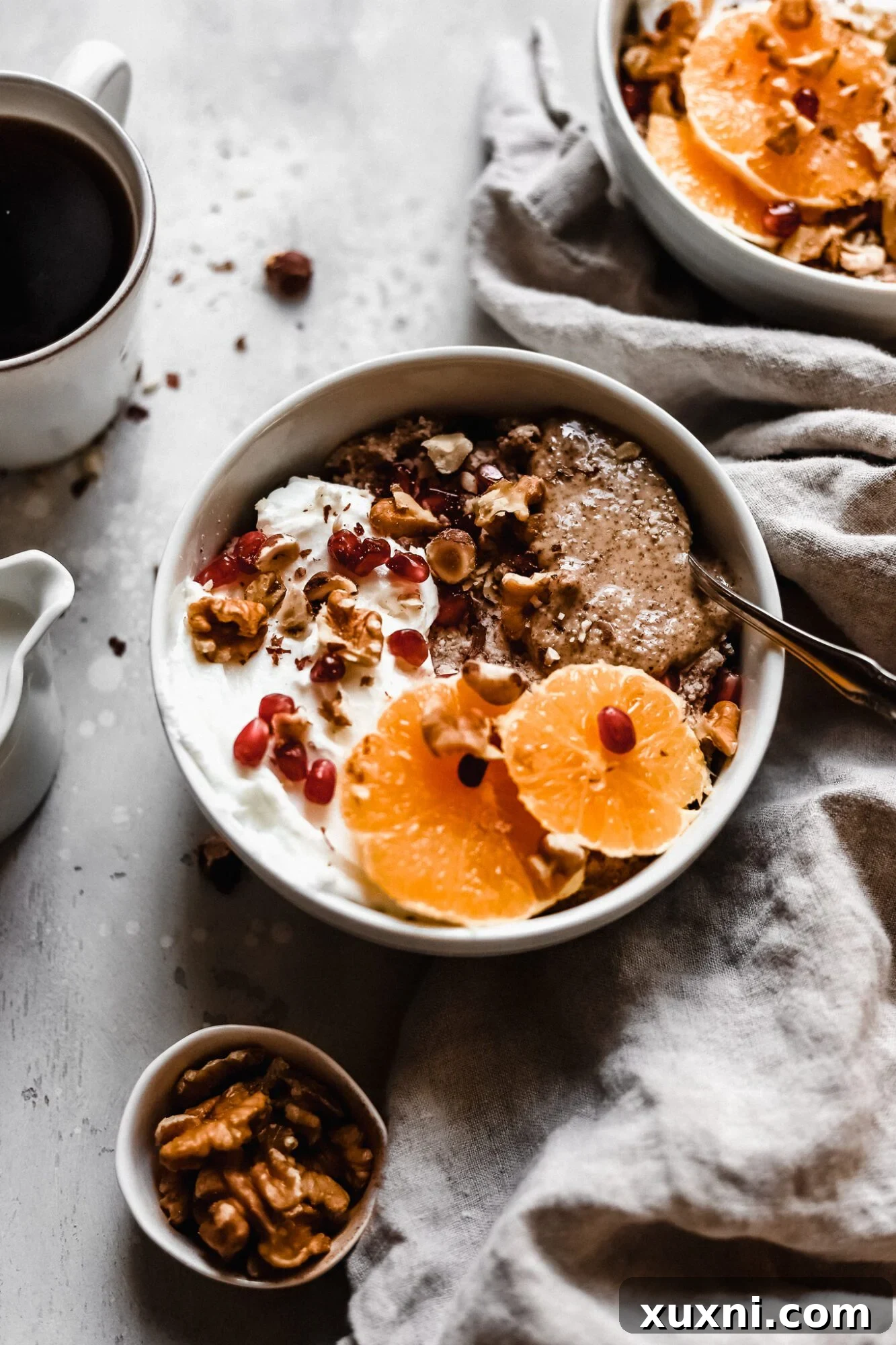 A beautifully presented vegan Whole30 breakfast bowl with orange slices and walnuts, ready to eat.