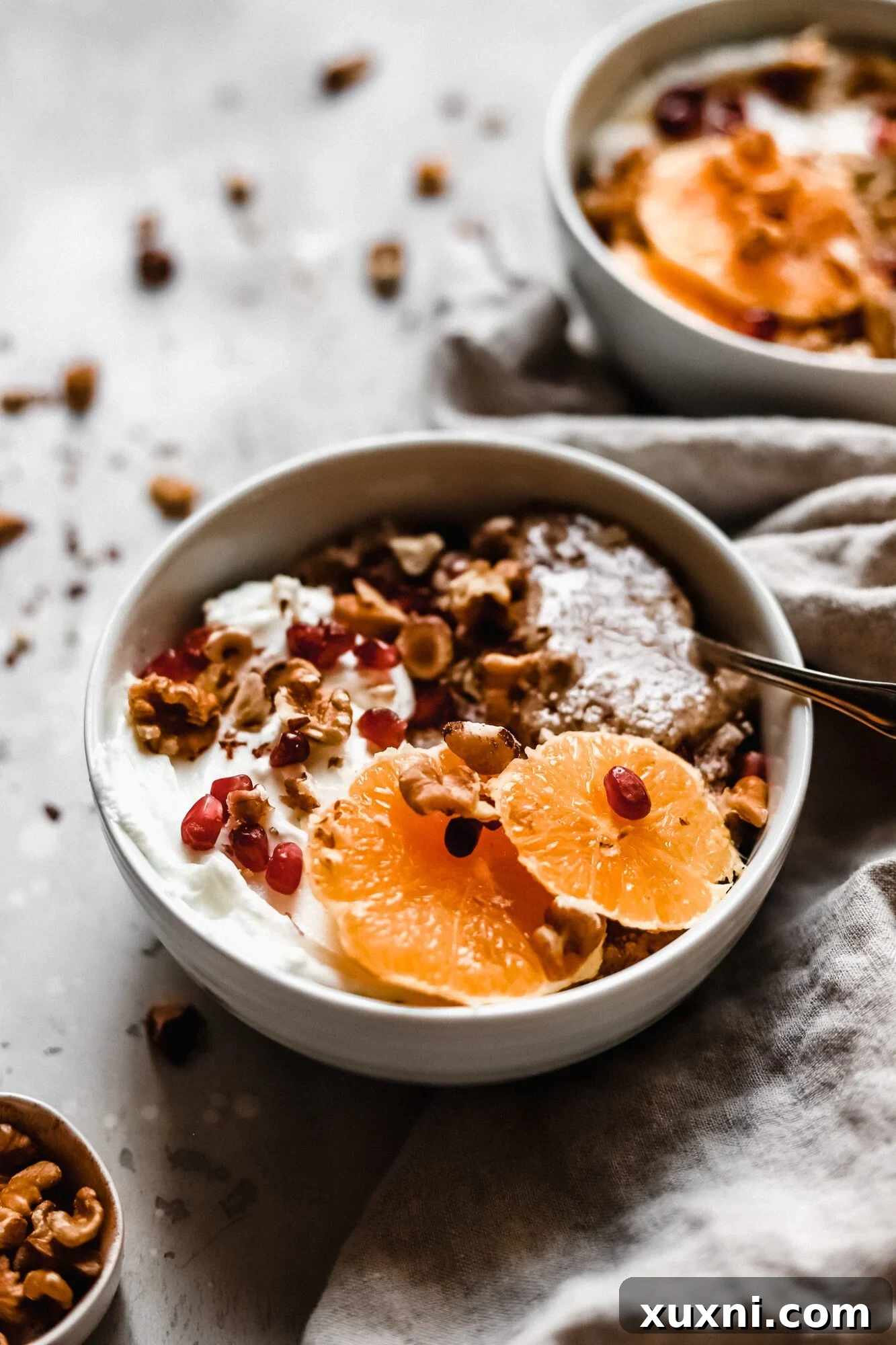 Multiple bowls of Whole30 grain-free oatmeal, artfully arranged for a healthy breakfast spread.