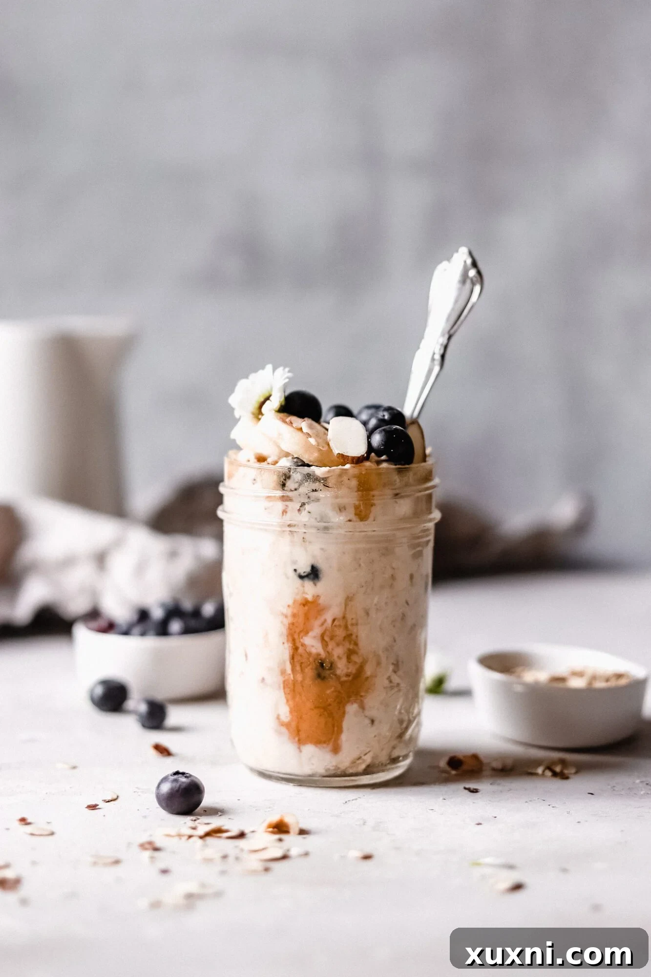 Single jar of vibrant blueberry overnight oats