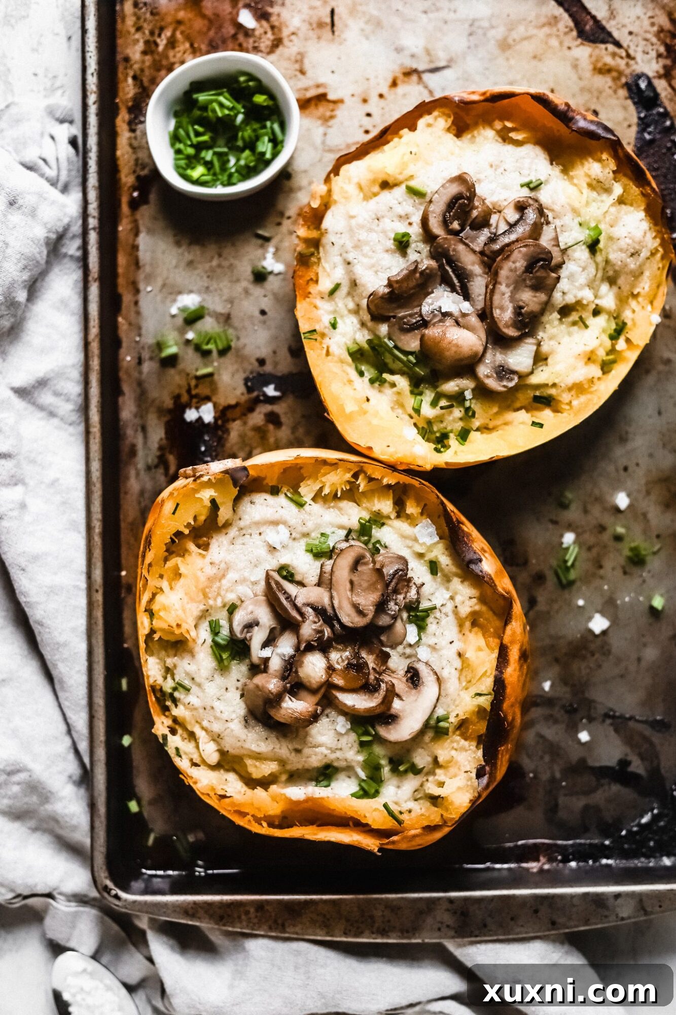 Deliciously creamy Whole30 spaghetti squash boats with an easy vegan Alfredo sauce for the best Paleo and Whole30 compliant meal! Packed with herby flavor and easy to make, you'll love this dinner option, and kids will as well!