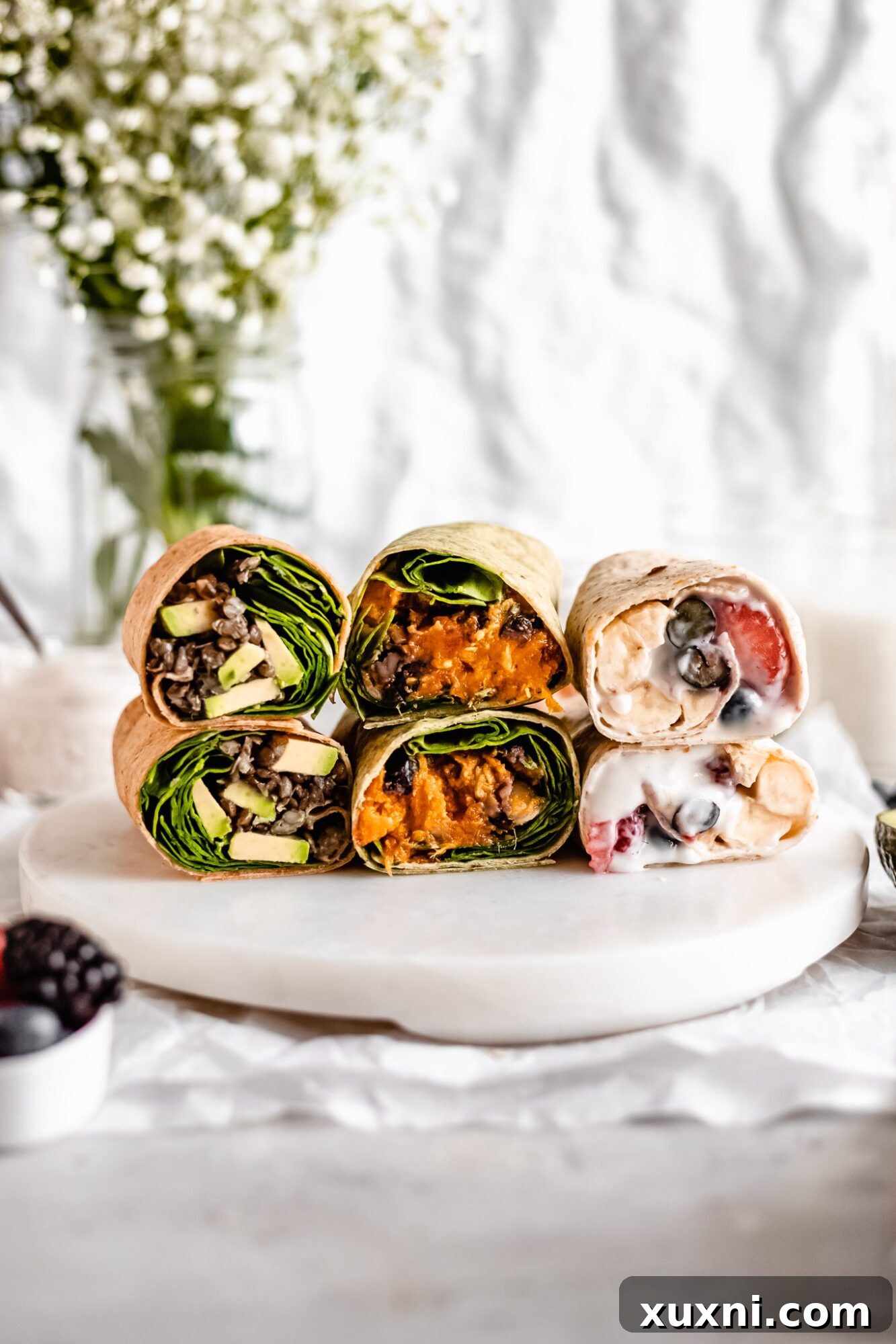 Three delicious high-protein vegan breakfast burritos, showcasing the different flavor combinations