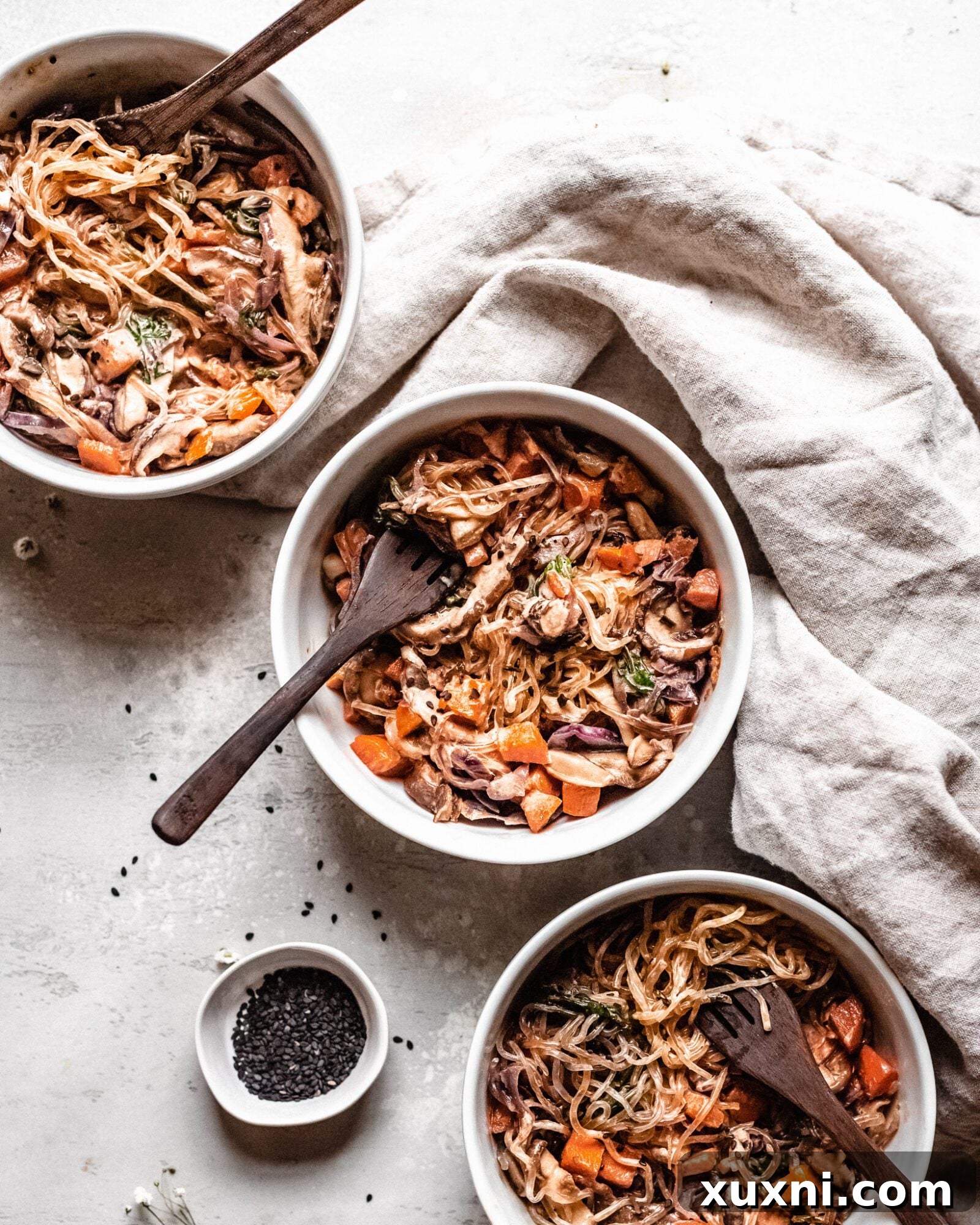 Effortless Keto Paleo Vegan Lo Mein Stir-Fry 3 three bowls of vegan lo mein with wooden forks
