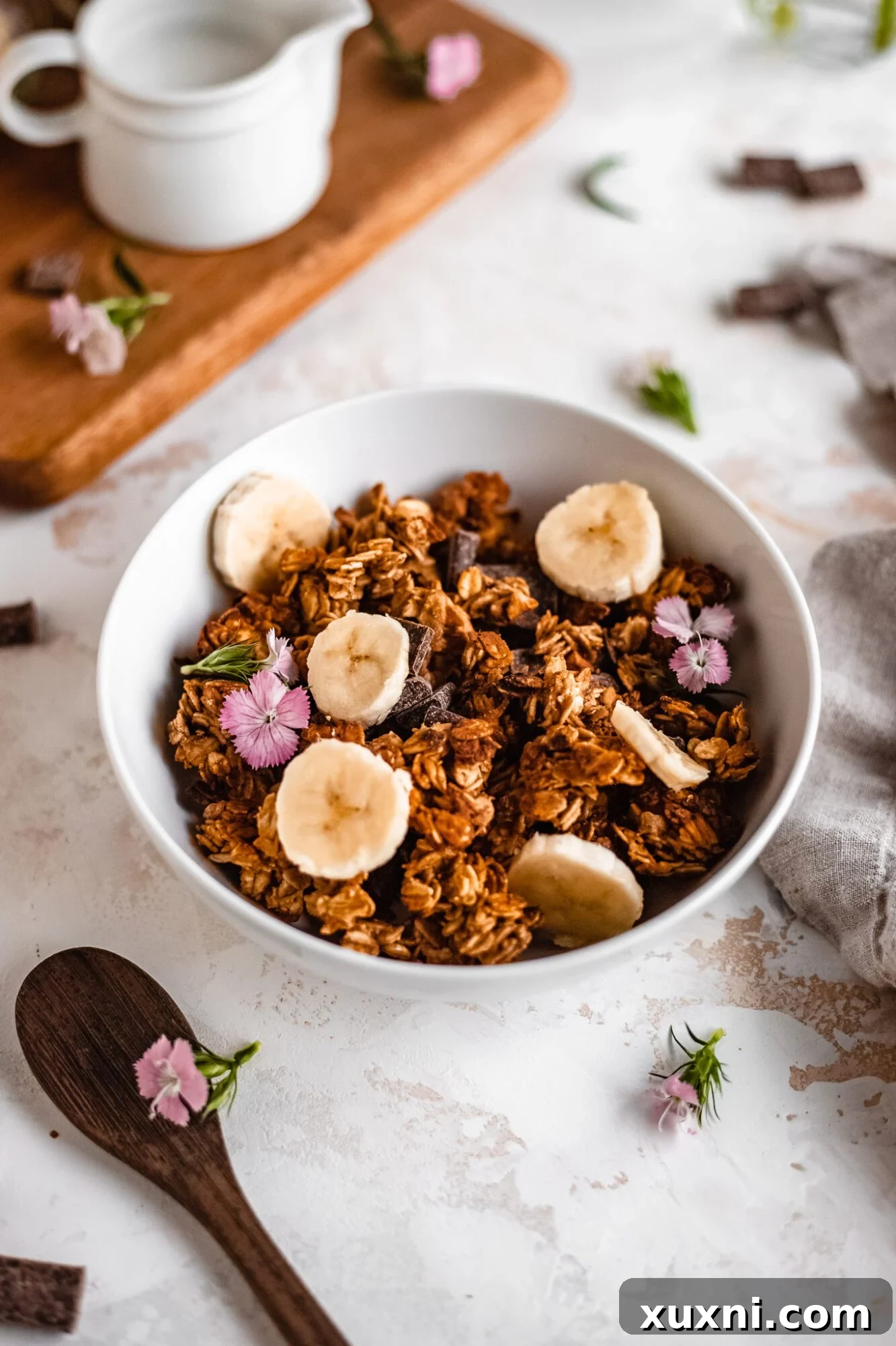 A simple bowl filled with crunchy, homemade banana bread granola, ready for a delightful breakfast or snack.