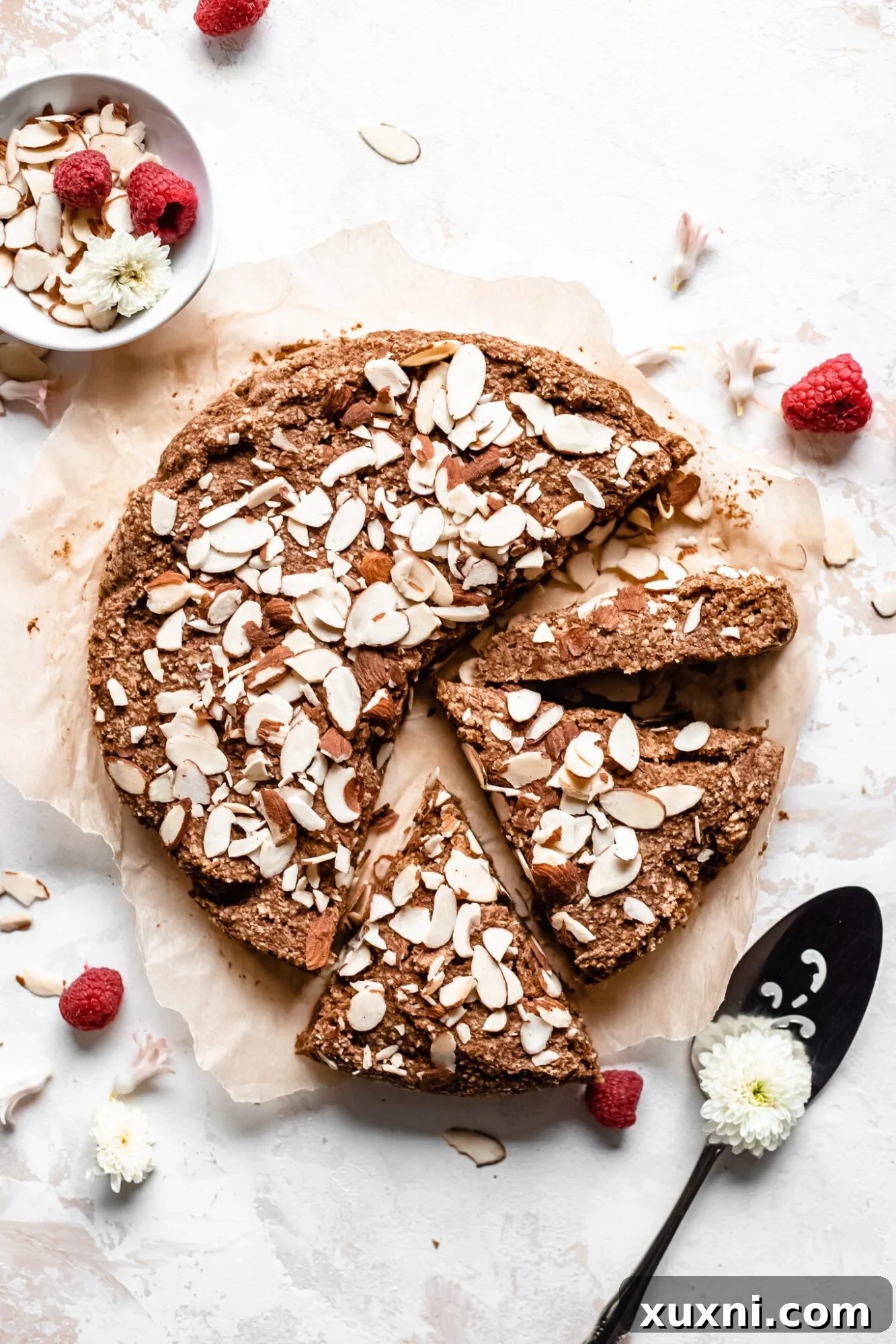 Sliced vegan gluten-free almond cake, perfect for a healthy breakfast or snack