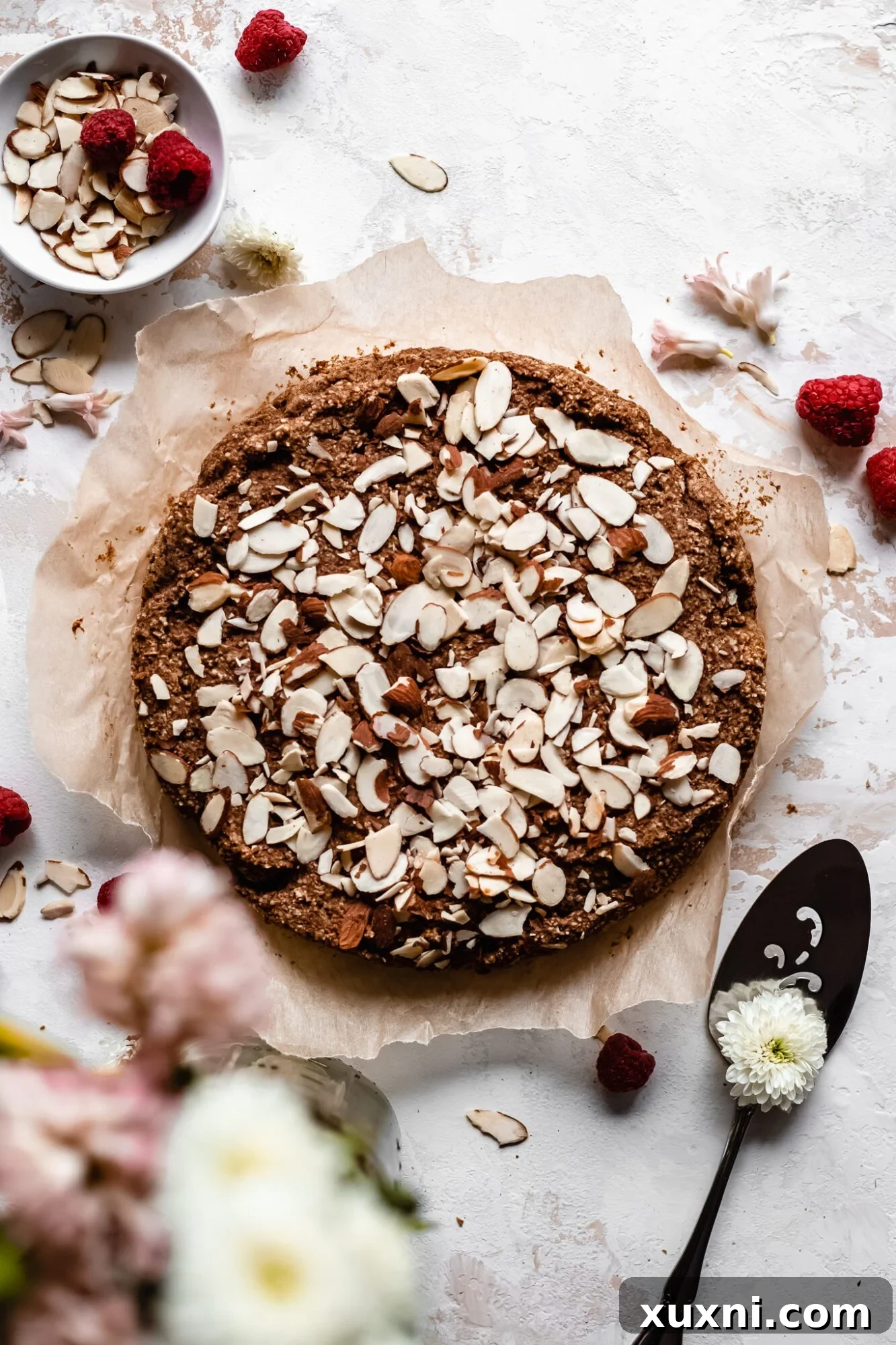 Whole gluten-free vegan almond cake, baked to golden perfection