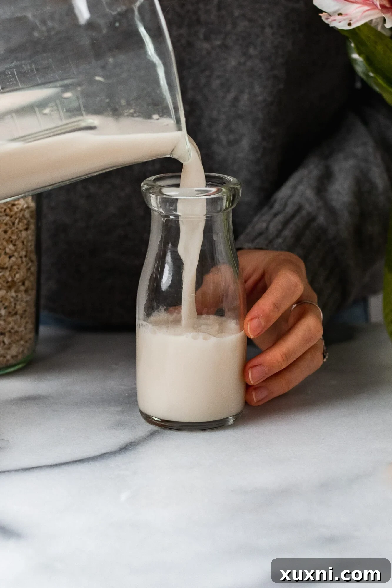 Finally Make Perfect Oat Milk With No Slimy Texture 11 pouring in homemade oat milk