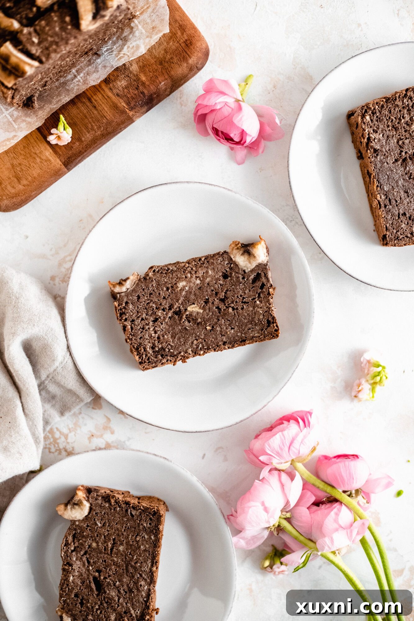 Effortless One-Bowl Vegan Gluten-Free Banana Bread 10 slices of banana bread on a white plate