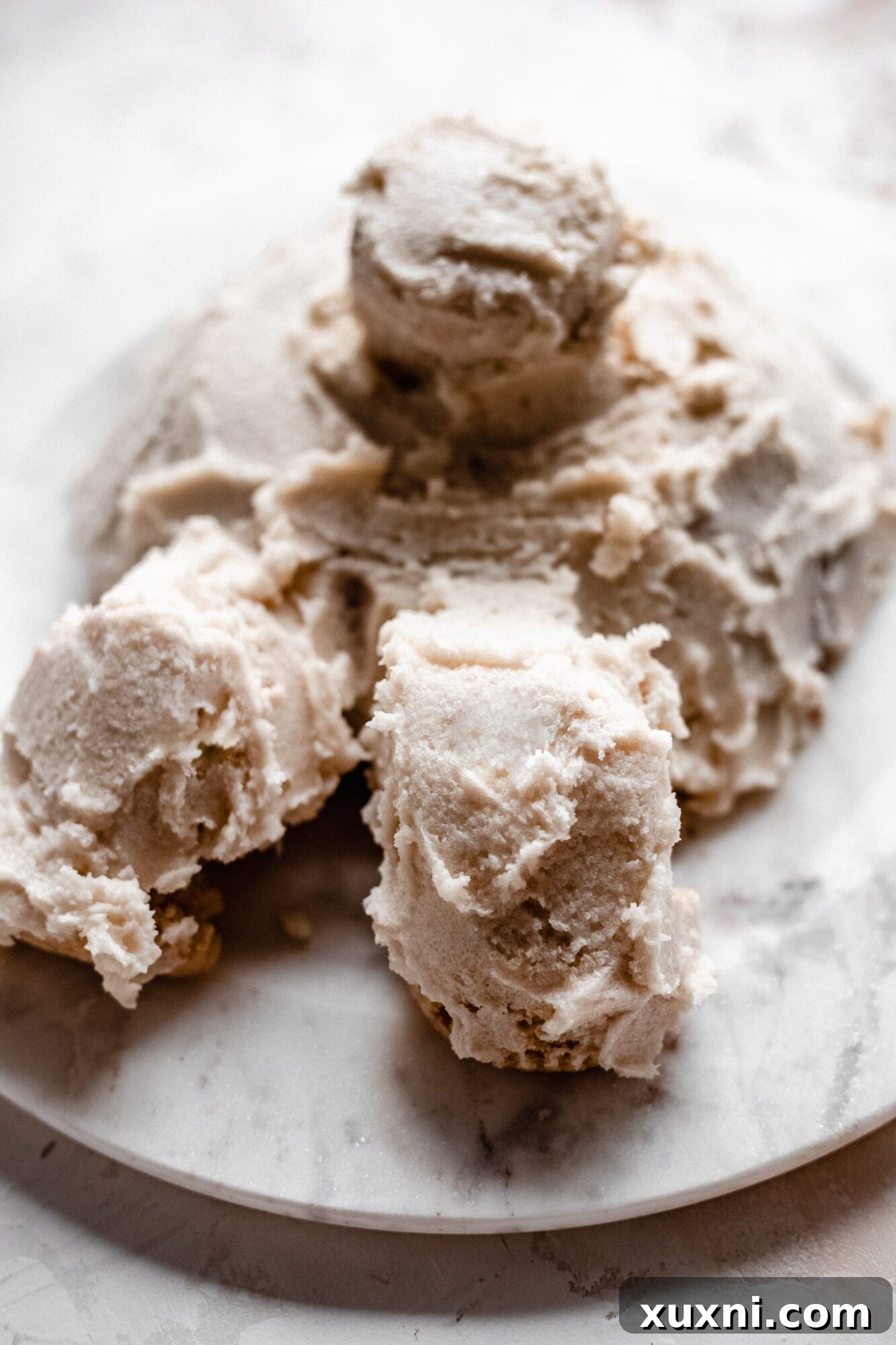 The fully frosted vegan vanilla bunny cake, smooth and ready for its coconut 'fur'