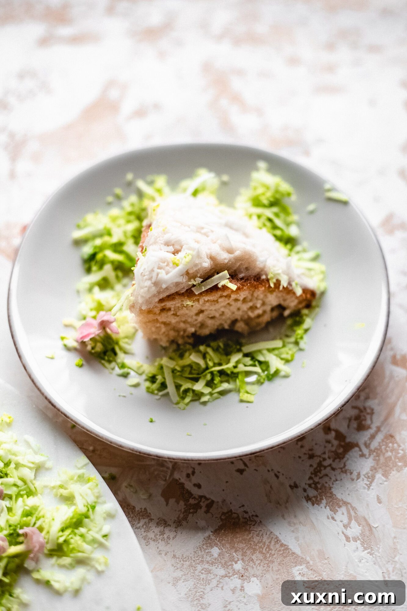 A perfectly sliced vegan bunny butt cake, showing the soft, moist interior