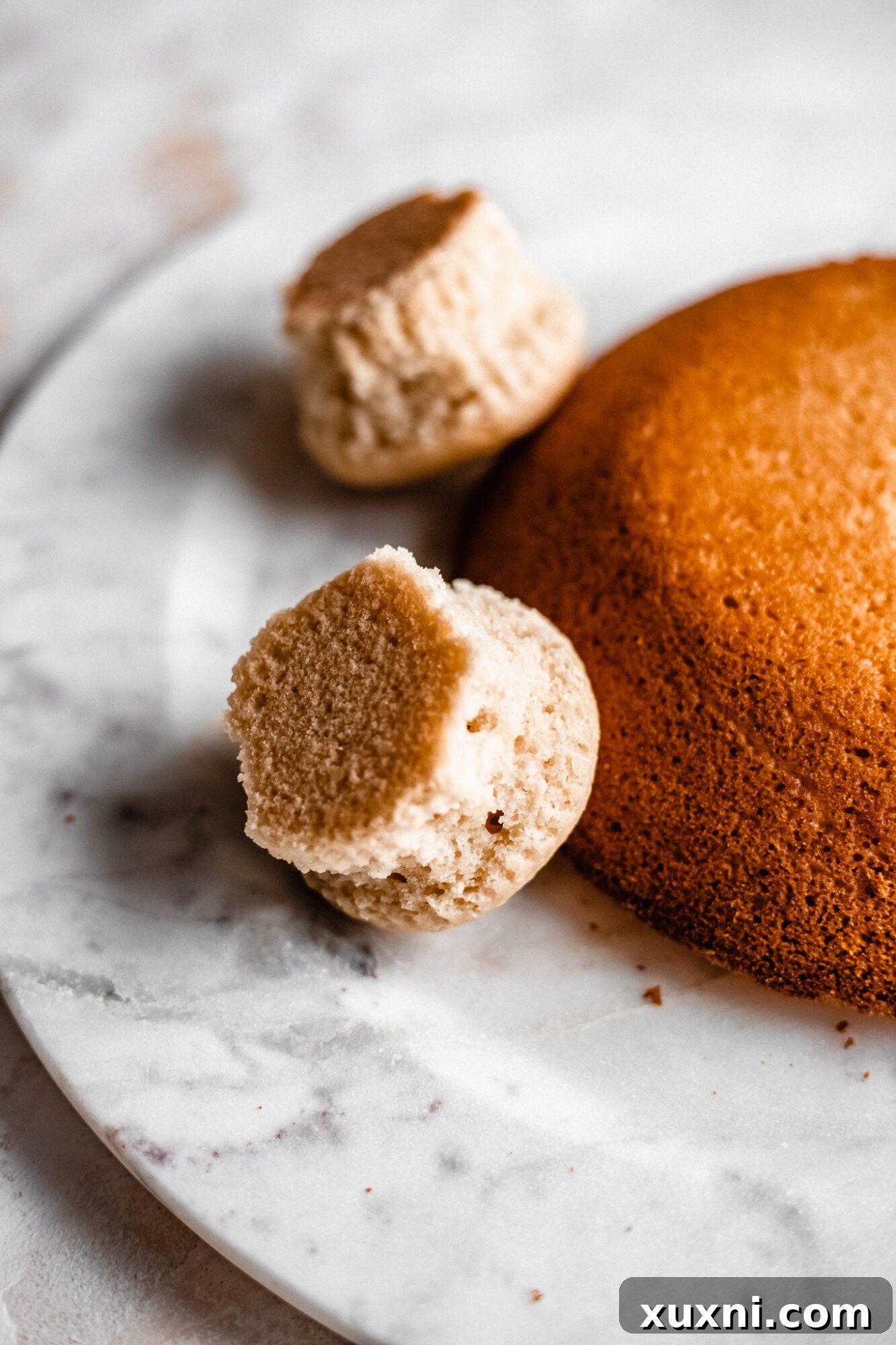 Side view of the vegan bunny butt cake assembly, showing the position of the cupcakes for the legs