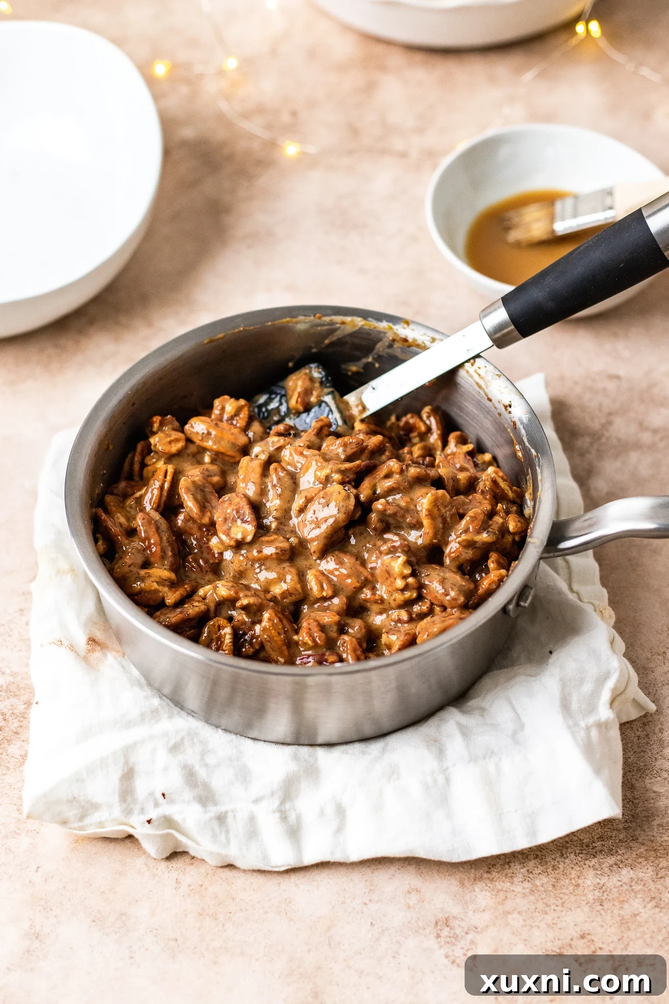 coated pecan halves in pecan pie filling