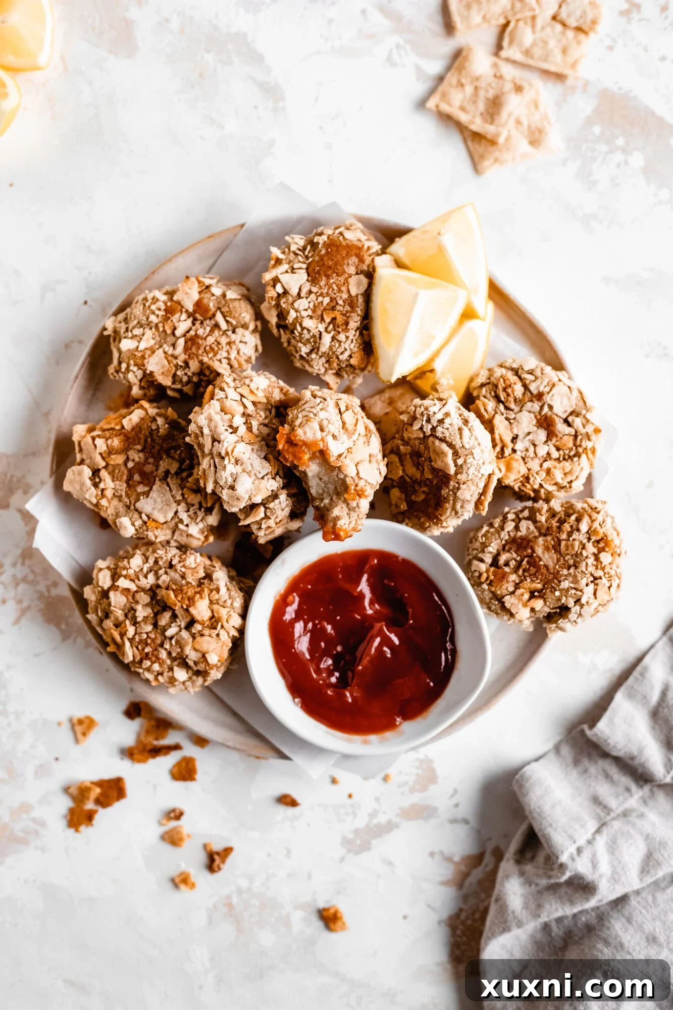 A vibrant plate of vegan cauliflower nuggets arranged neatly, highlighting their golden color and inviting texture.