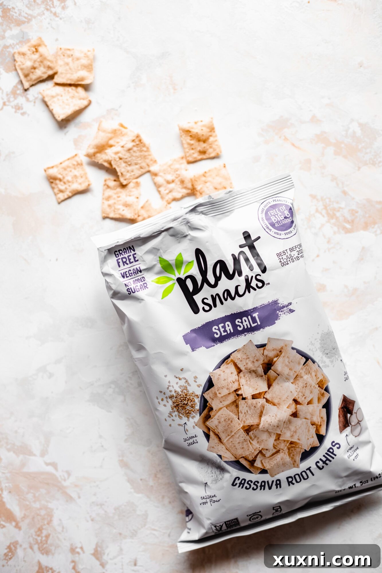 An open bag of Plant Snacks Sea Salt Cassava Root Chips, showing the crispy texture of the chips, ready to be used as a breading.