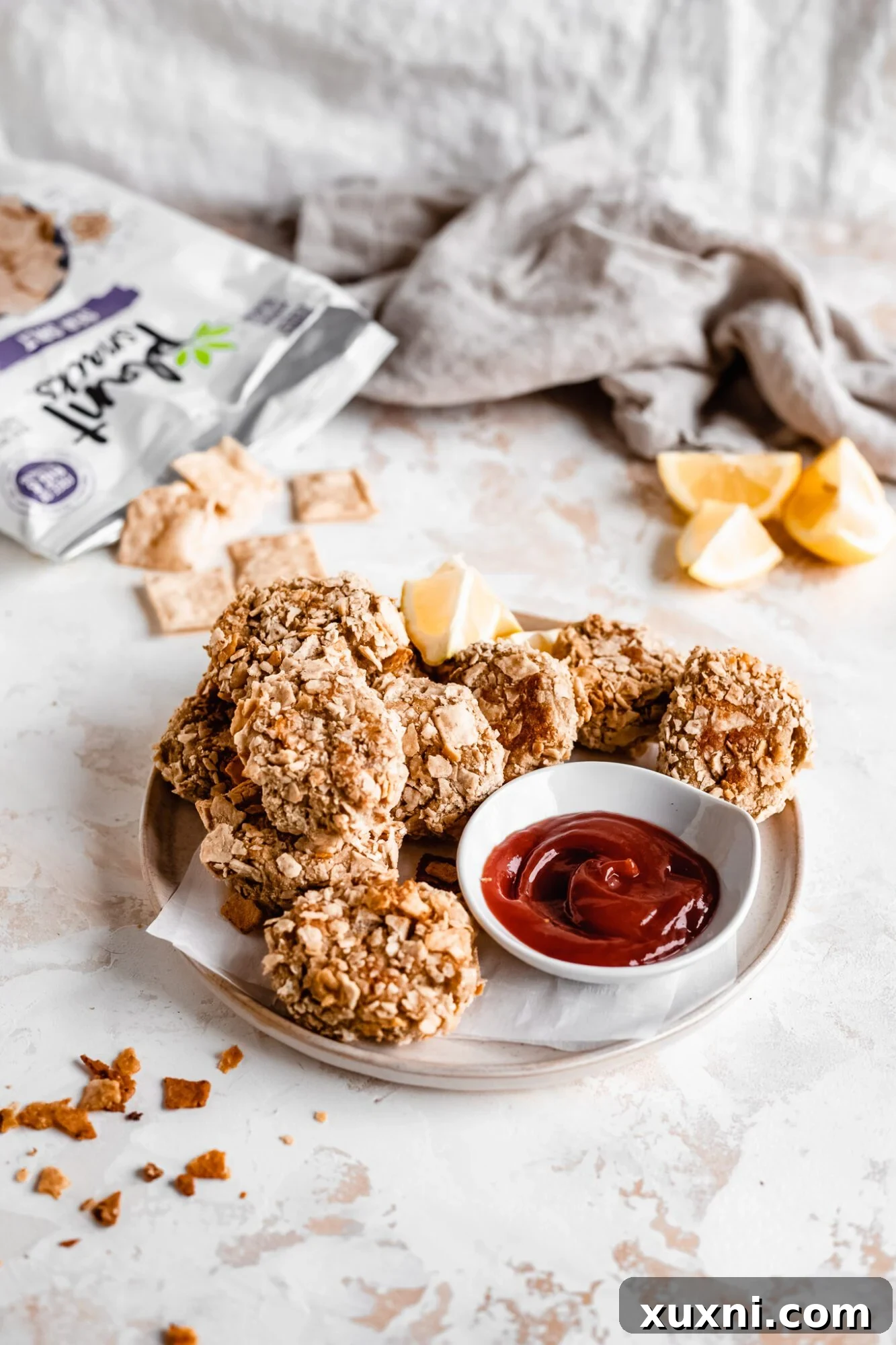 A generous serving of crispy, golden soy-free vegan chicken nuggets on a plate, ready to be enjoyed.
