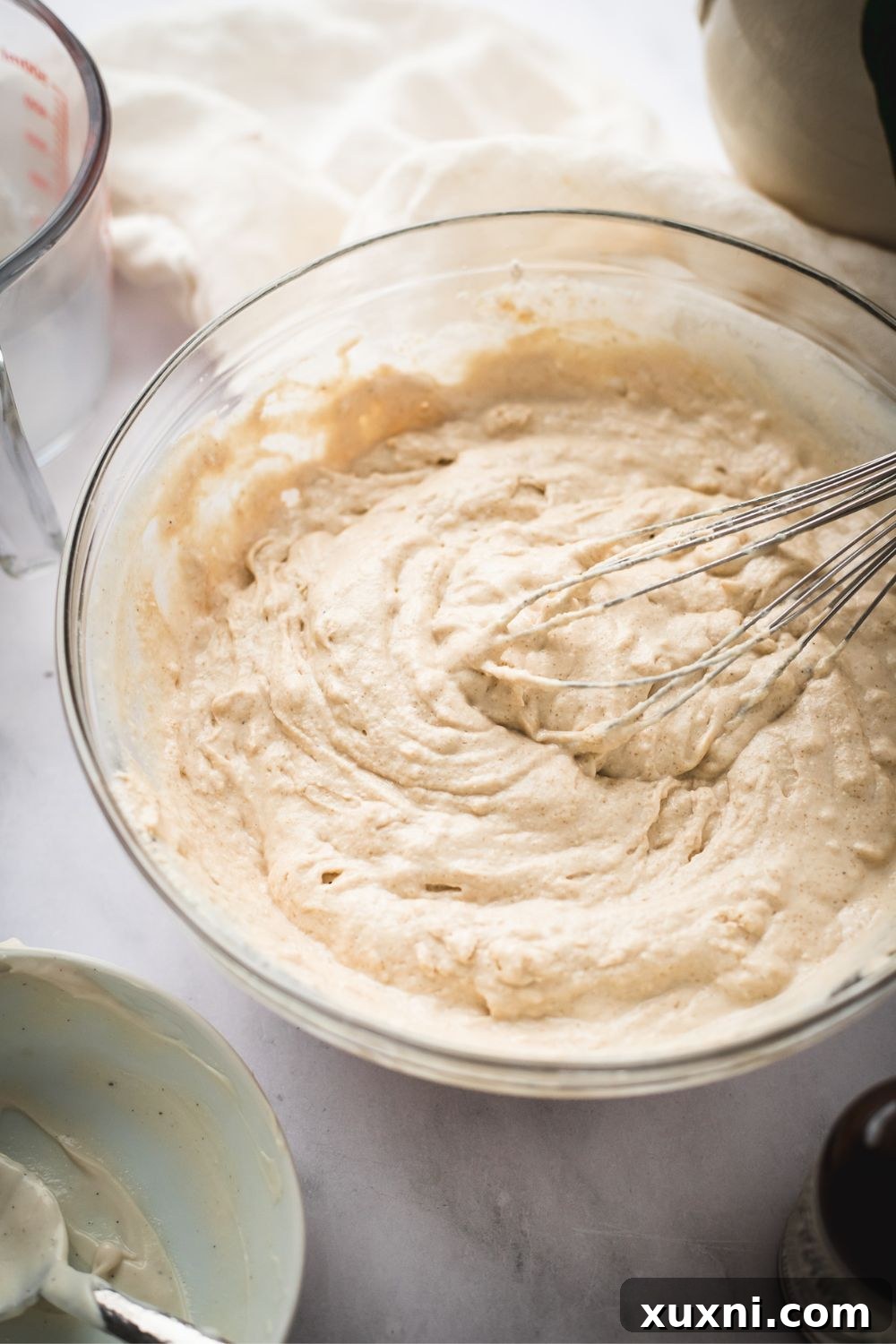 Smooth and well-mixed vegan waffle batter in a bowl, ready to be cooked.