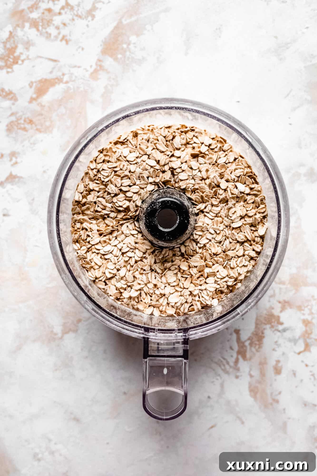 Whole rolled oats ready to be processed in a food processor