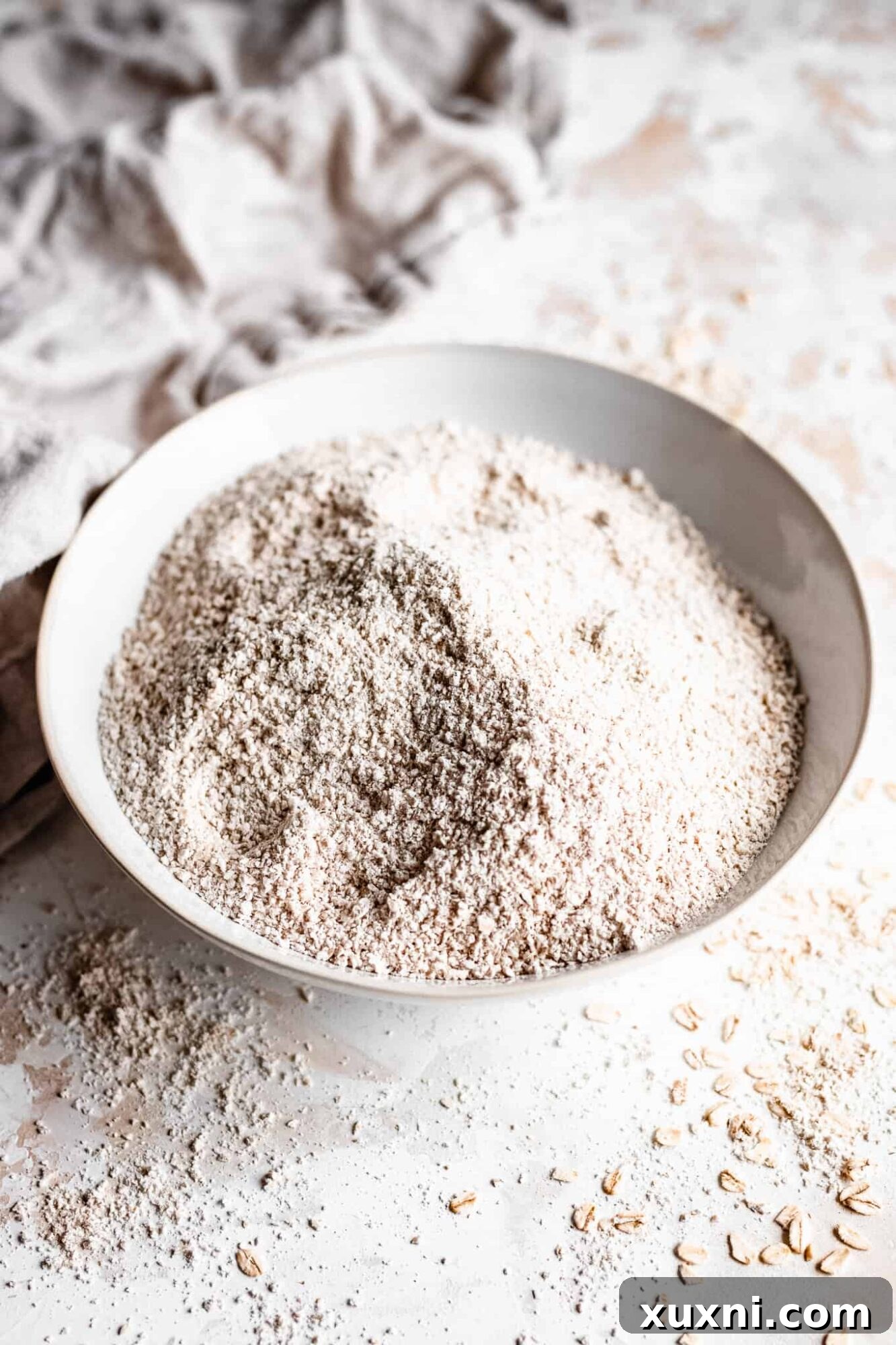 Bowl of fluffy oat flour ready for baking