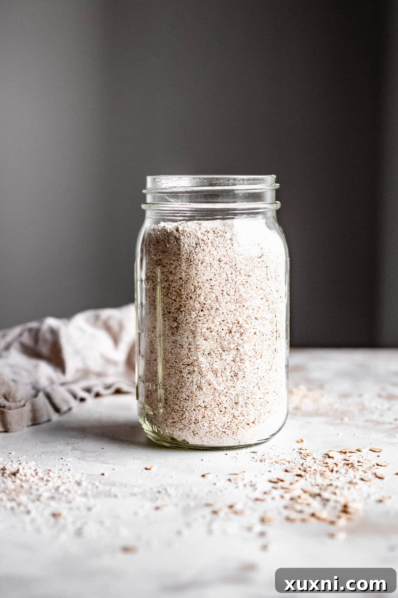 Mason jar filled with freshly prepared oat flour