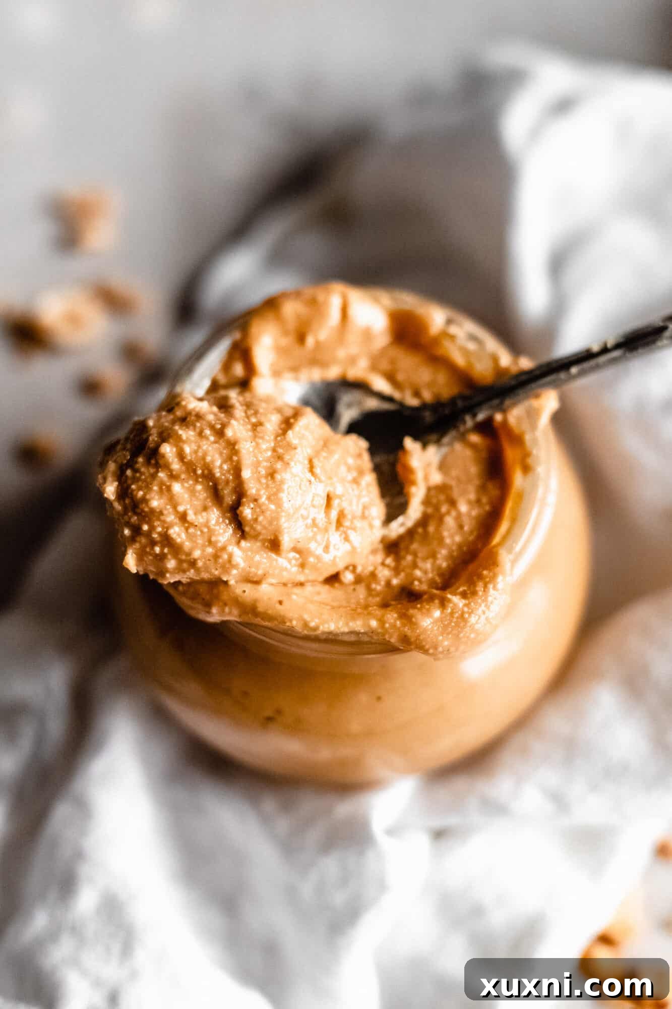 spoon resting on nut butter jar