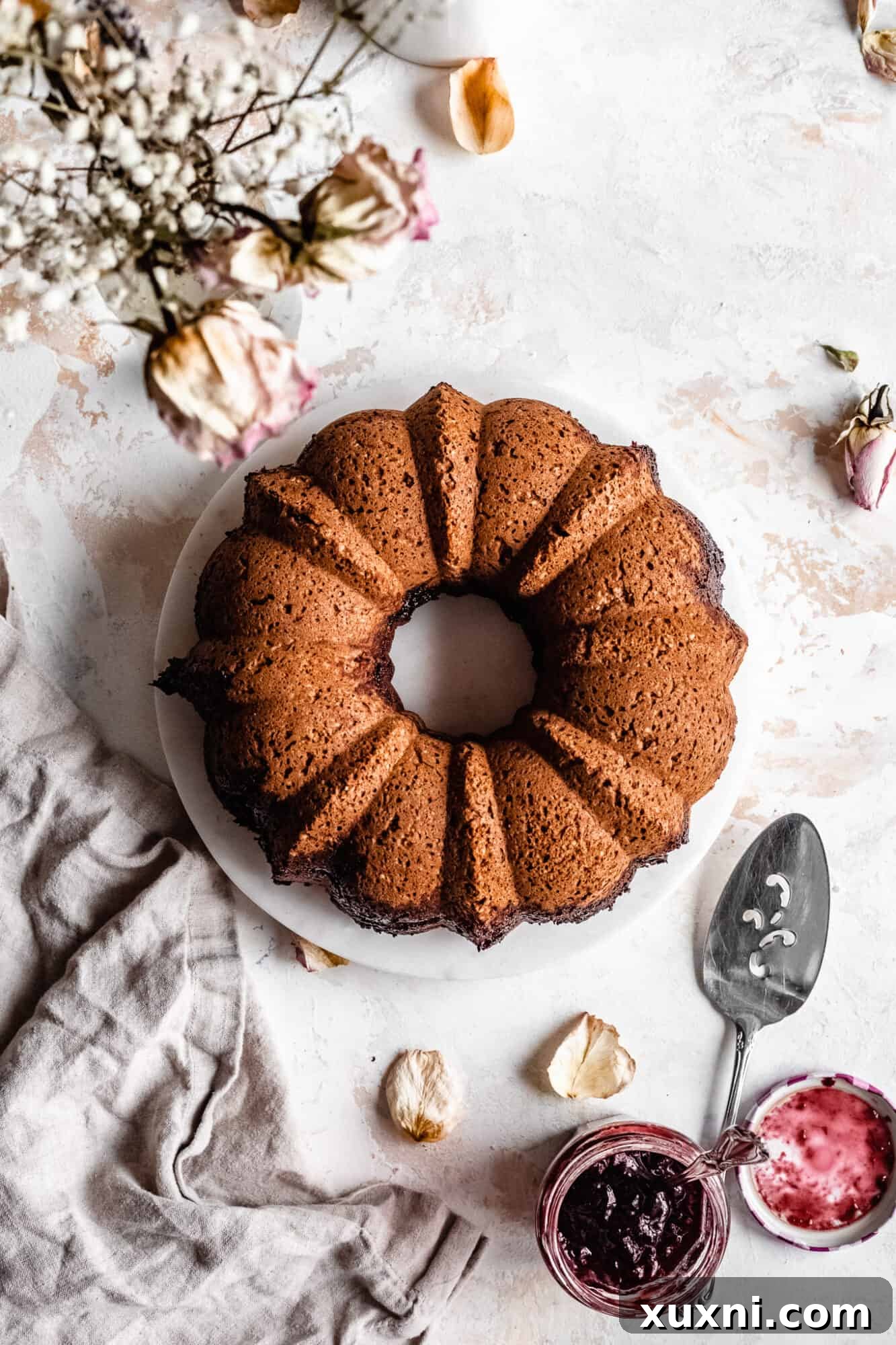 A perfectly baked vegan bundt cake, golden brown and ready to cool.