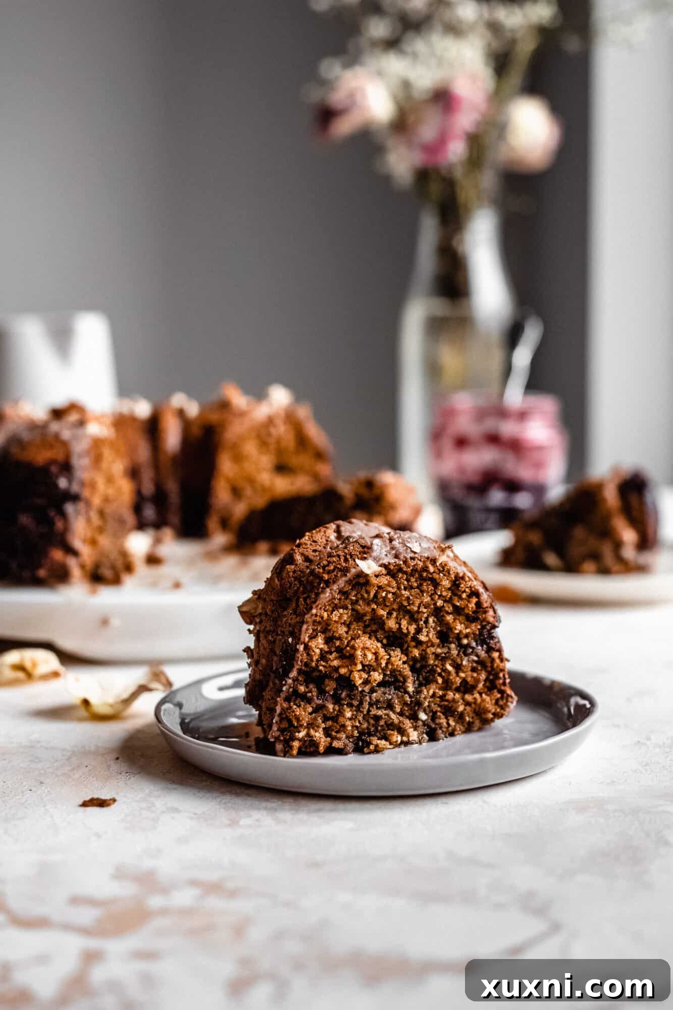 A single slice of bundt cake on a plate, showcasing its fluffy texture.