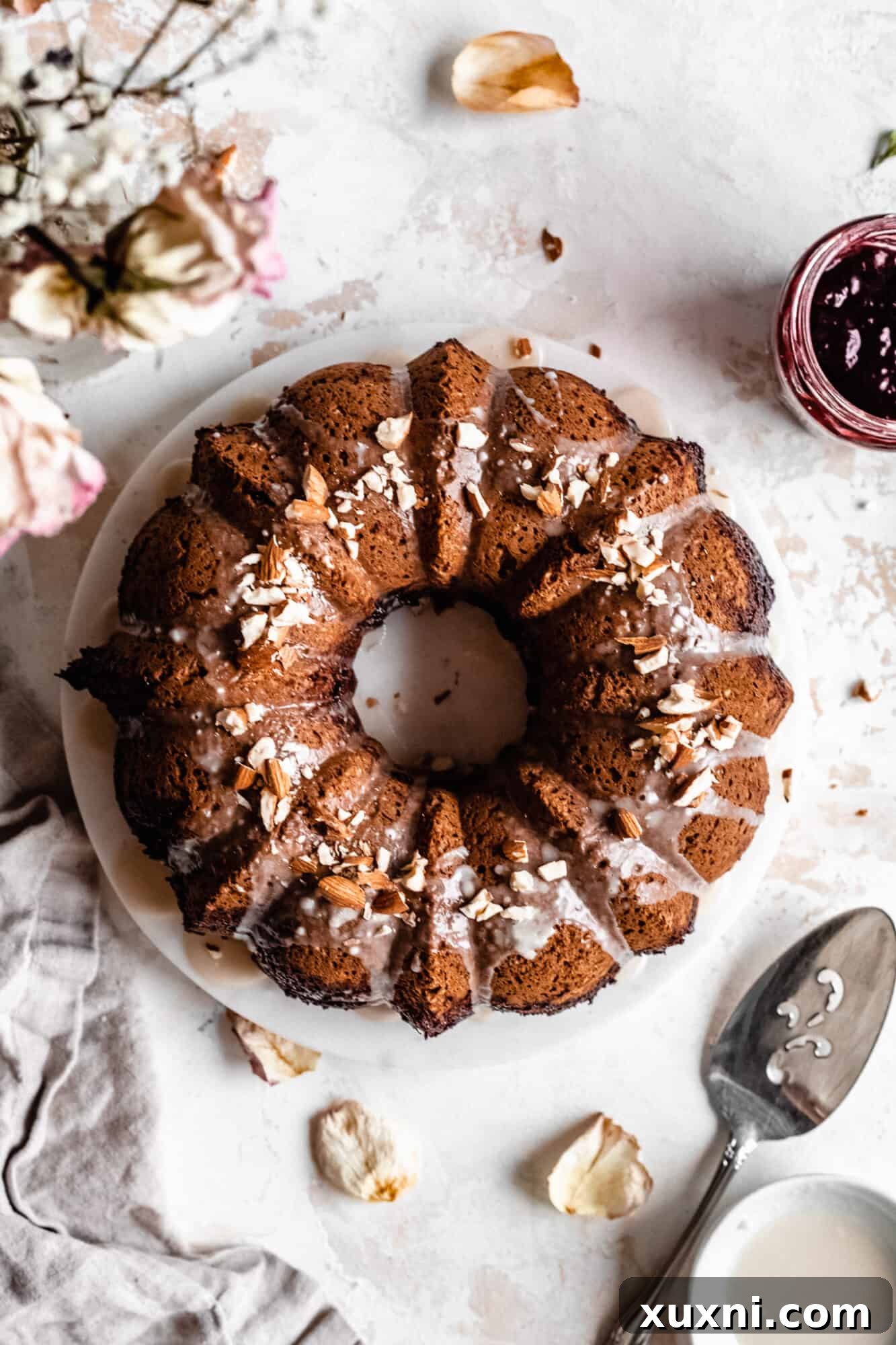 An overhead shot of the almond bundt cake, perfectly glazed and ready to serve.