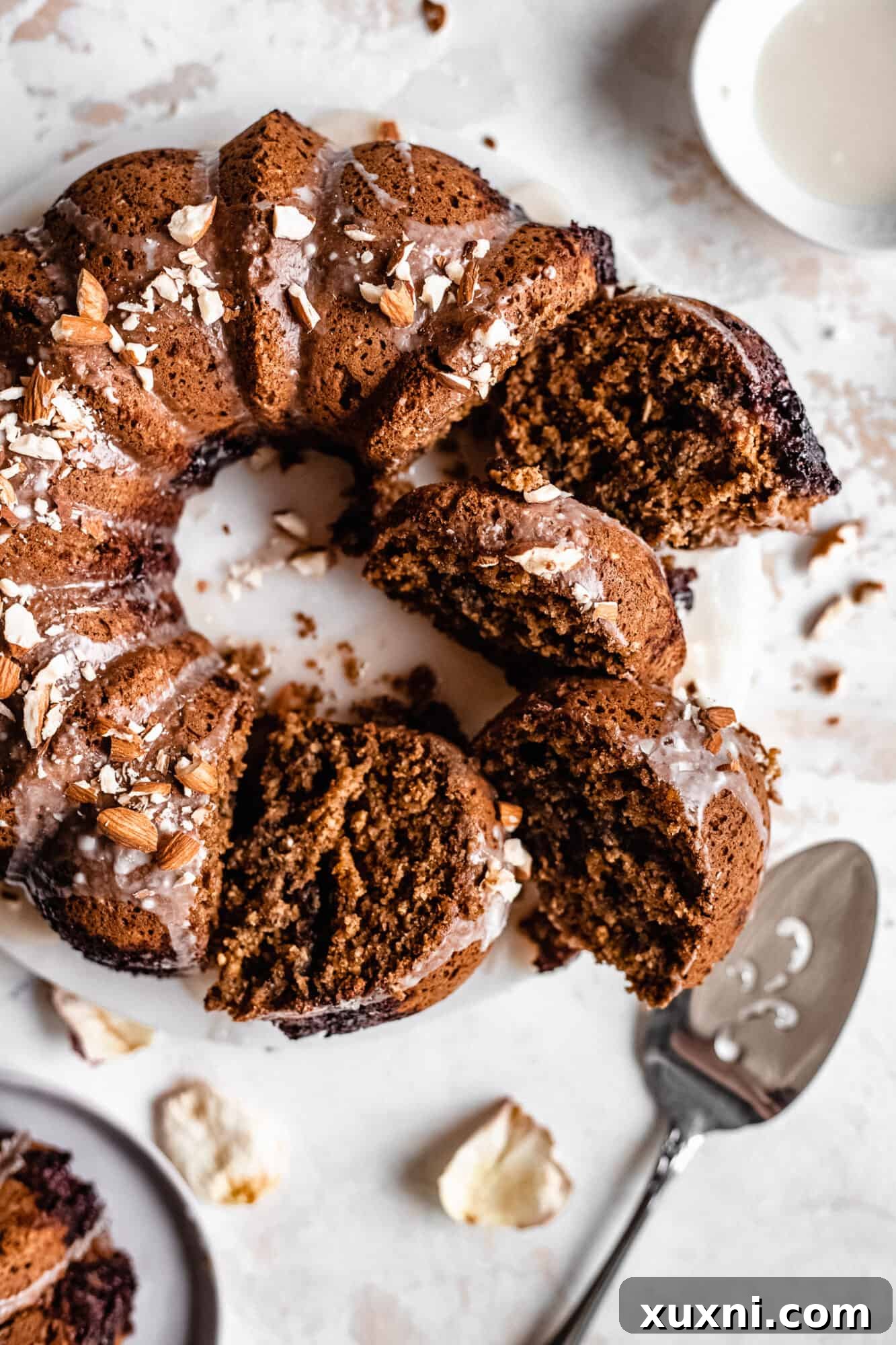 Several slices of the bundt cake artfully arranged, highlighting its moist interior.