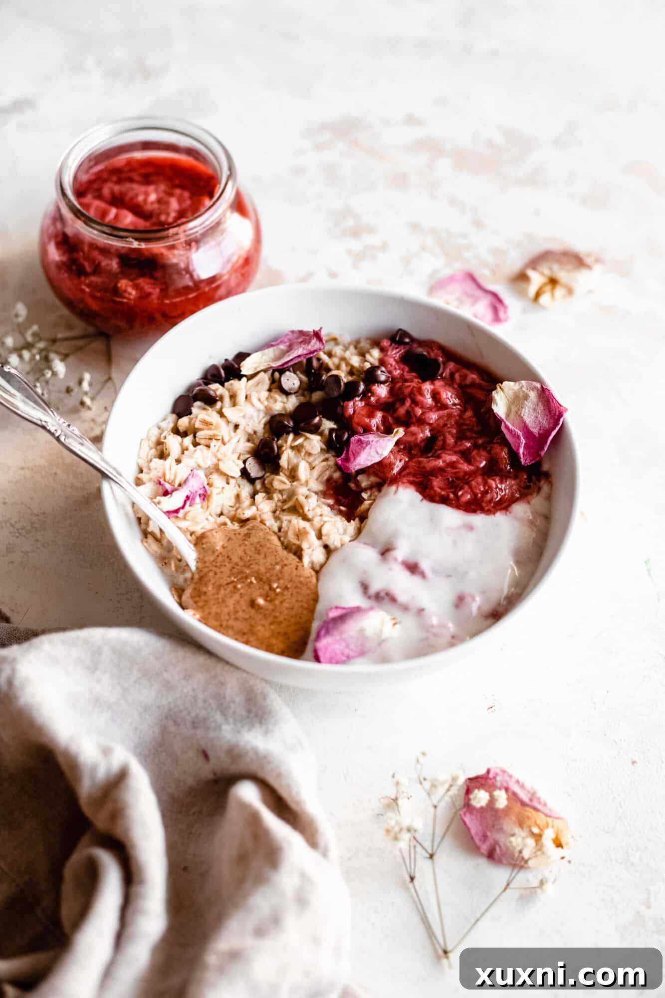 bowl of oatmeal with strawberry jam
