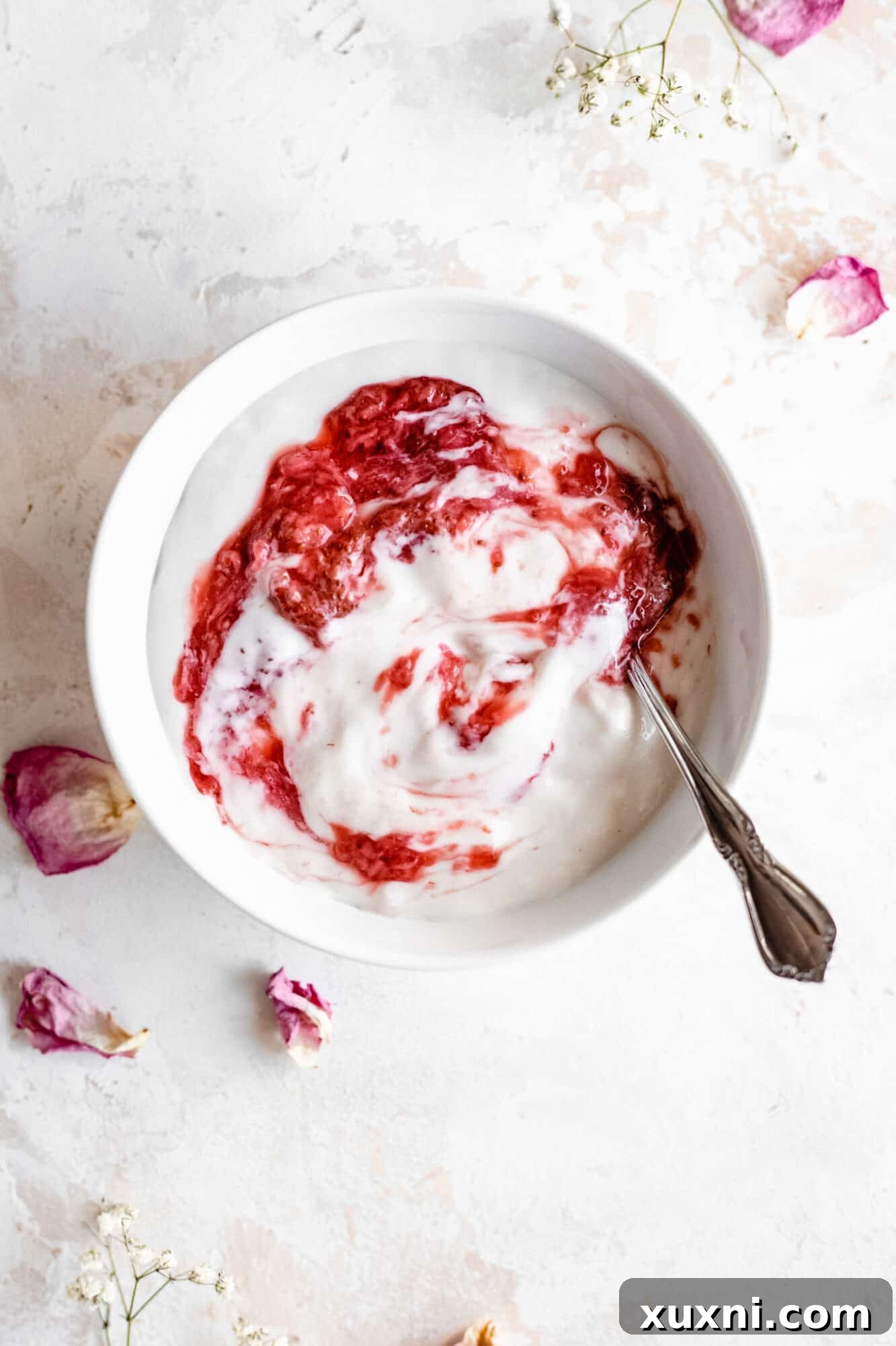 bowl of yogurt with strawberry jam