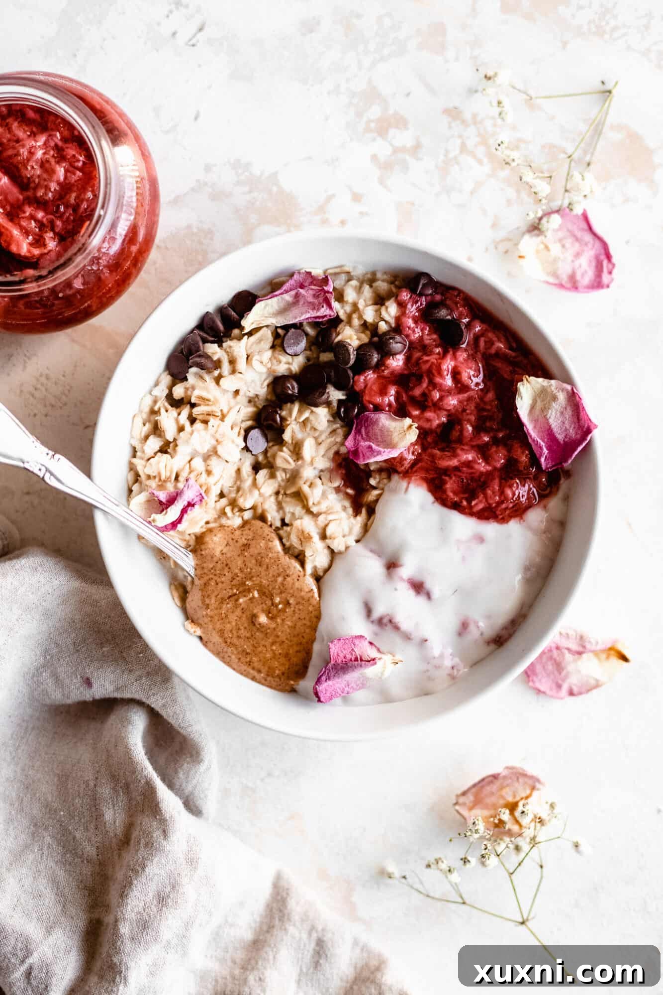 bowl of oats with strawberry jam