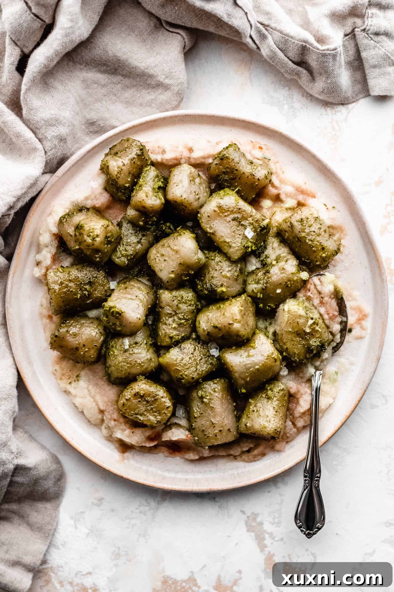 A plate of paleo vegan cauliflower gnocchi, a healthy and comforting pantry meal.