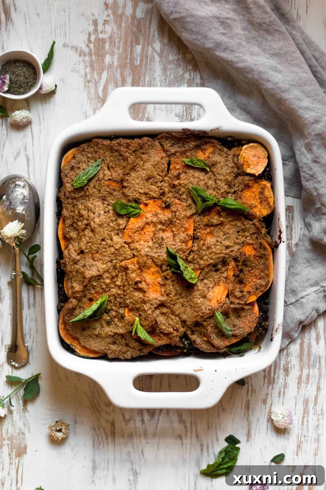 A generous slice of vegan lentil lasagna, a comforting and hearty pantry meal.