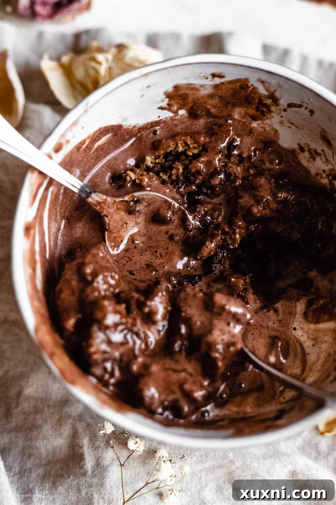 Close-up of a vegan mug cake, showcasing its perfectly baked appearance and readiness to be enjoyed