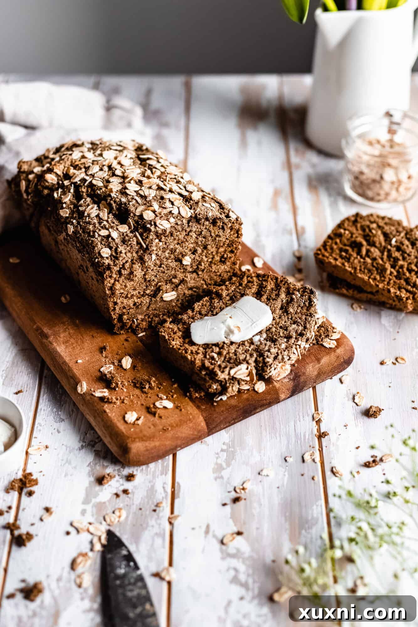 slice of oatmeal bread with pat of vegan butter