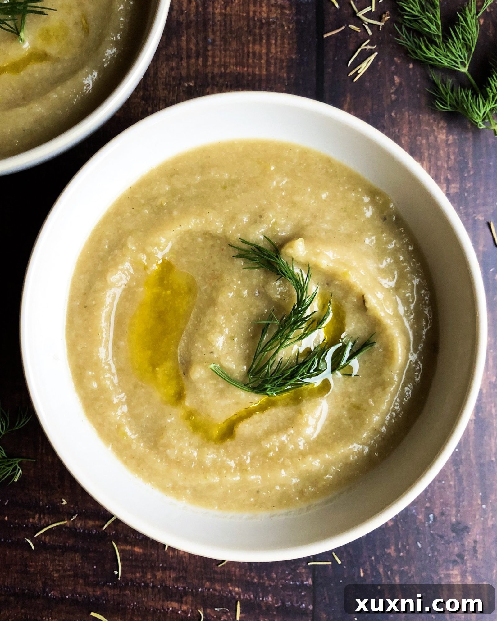 Creamy Vegan Cauliflower Delight 3 Close-up of a serving of Whole30 dairy-free creamy cauliflower soup, showcasing its smooth texture and rich color, ready to be enjoyed as a healthy and filling meal.