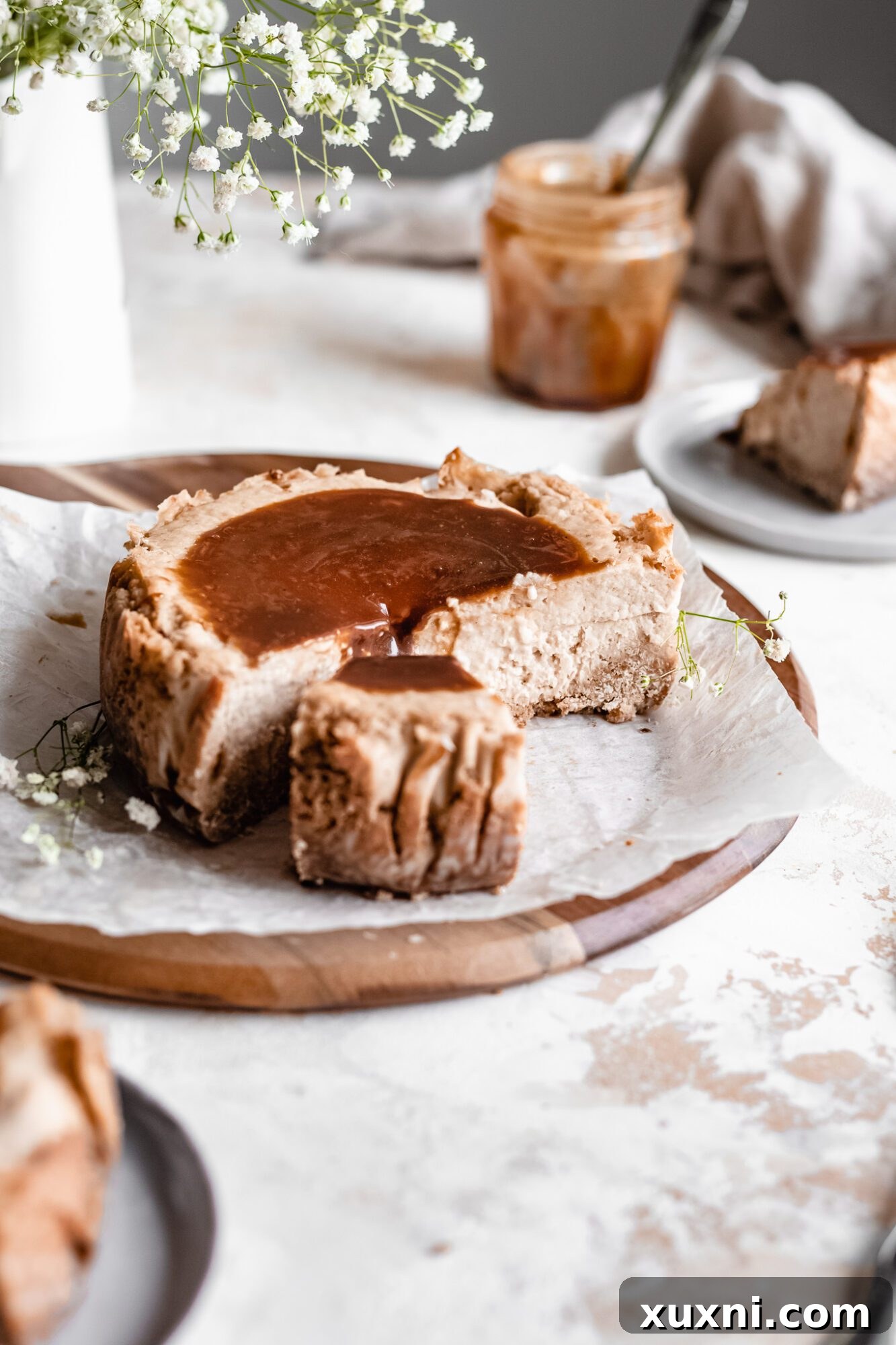 slice being pulled from cheesecake 