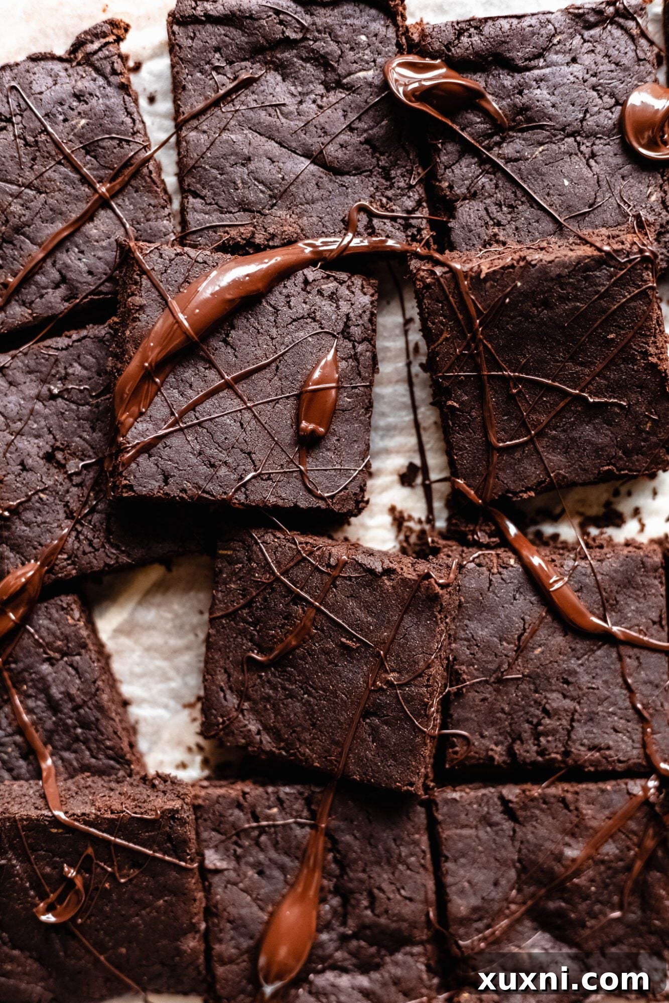 Decadent Paleo Vegan Zucchini Brownies 3 Close up of healthy brownies drizzled in melted chocolate