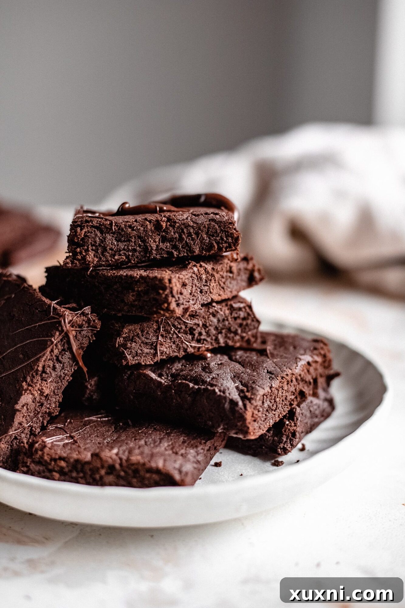 Decadent Paleo Vegan Zucchini Brownies 9 Close ups of brownie stack with chocolate drizzle