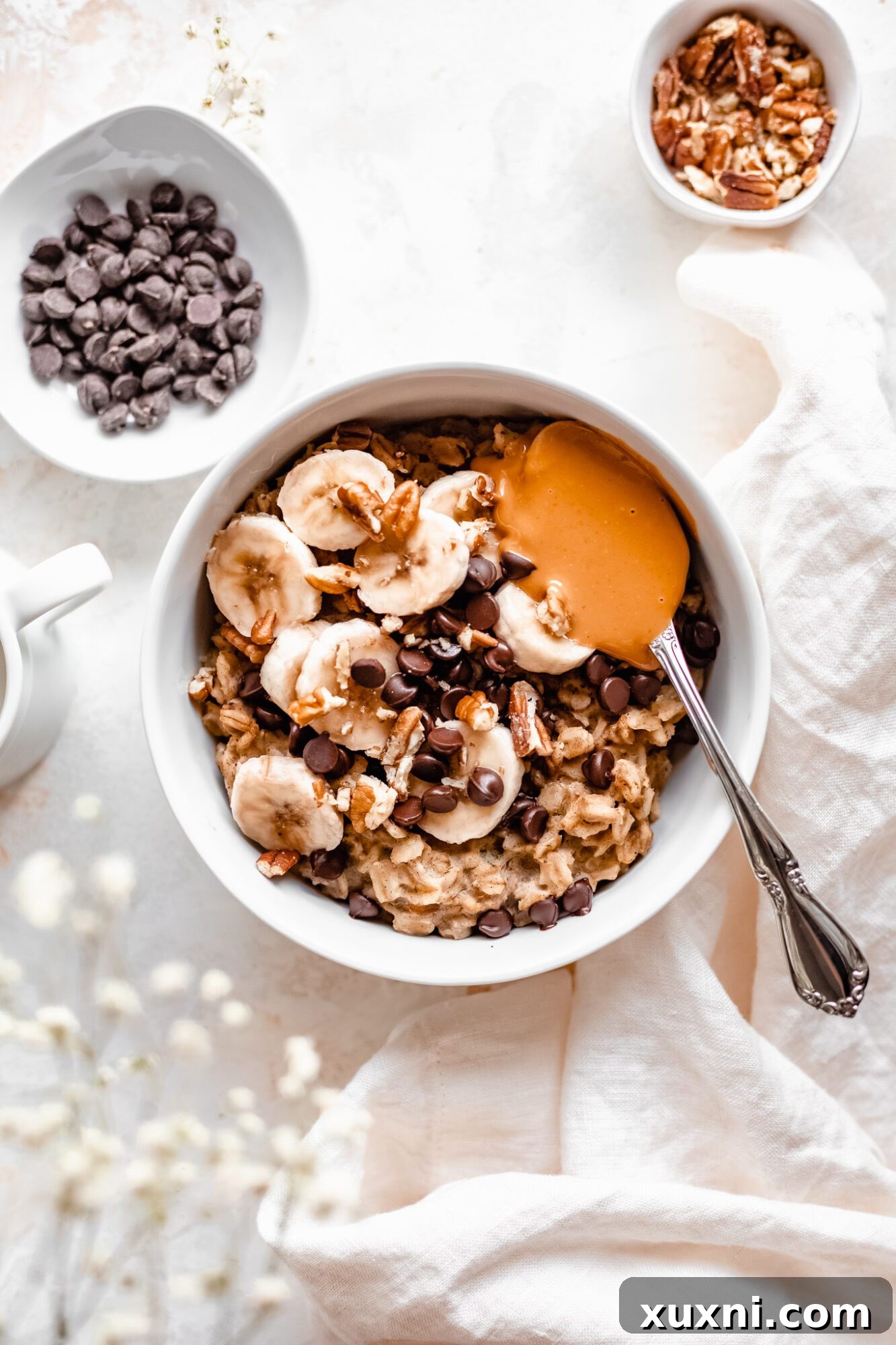 Instant Pot Protein Packed Vegan Zucchini Oatmeal 2 bowl of healthy instant pot zucchini oatmeal with toppings like bananas, nuts, and chocolate chips