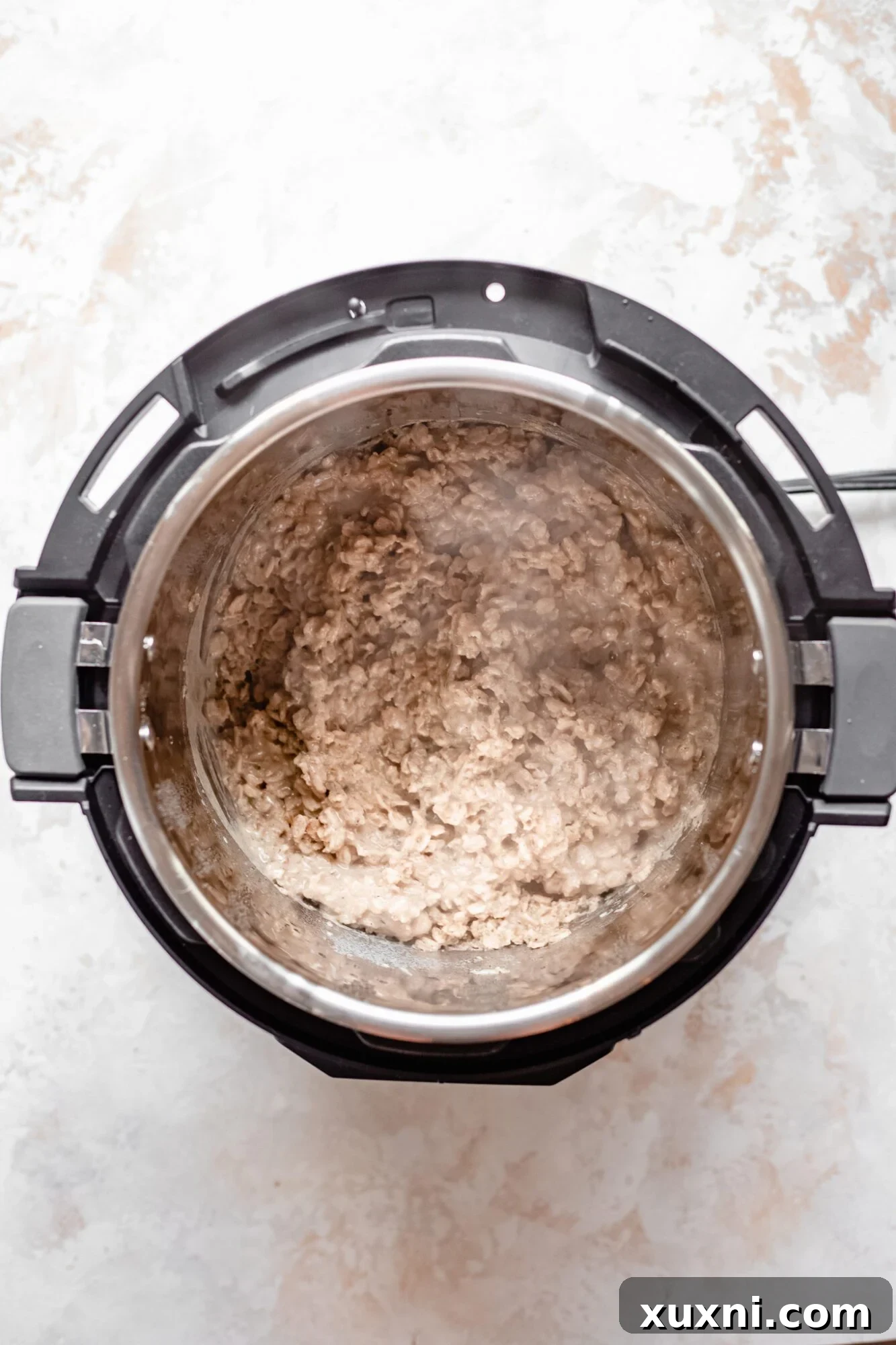 Instant Pot Protein Packed Vegan Zucchini Oatmeal 11 cooked zucchini oatmeal inside the Instant Pot after pressure release