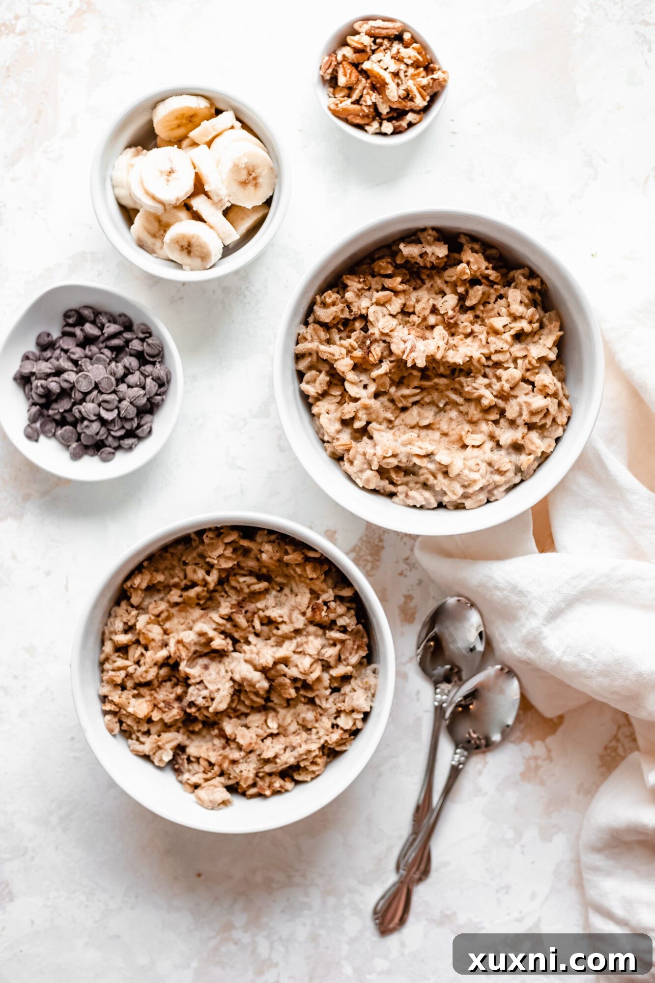 Instant Pot Protein Packed Vegan Zucchini Oatmeal 12 bare oatmeal bowls with various topping options laid out