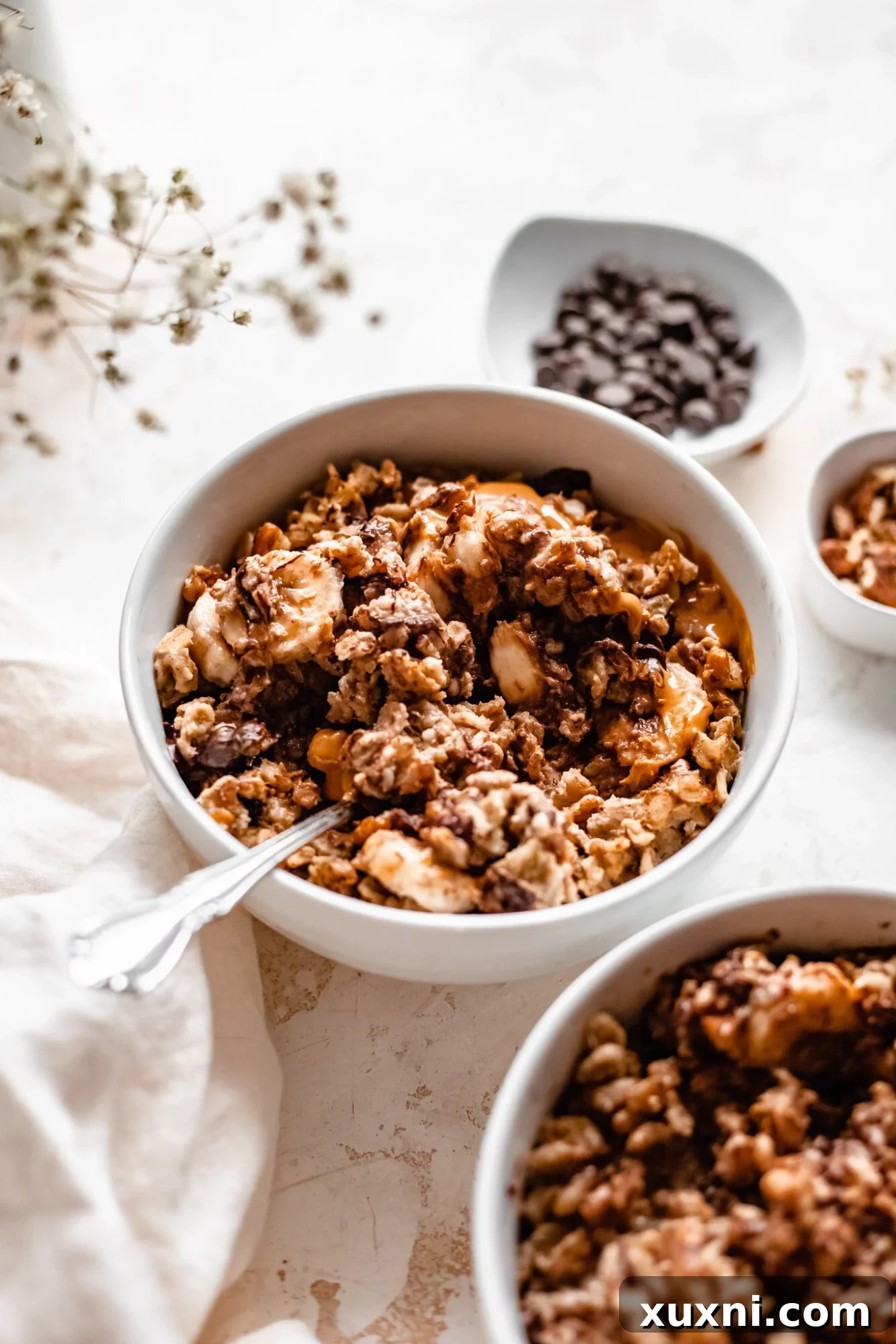 Instant Pot Protein Packed Vegan Zucchini Oatmeal 4 various bowls of mixed oatmeal, some with toppings