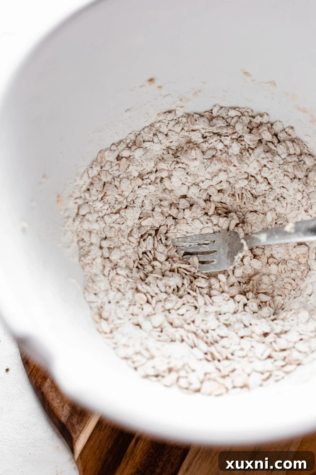 Dry ingredients for oat crumble before mixing with wet ingredients.
