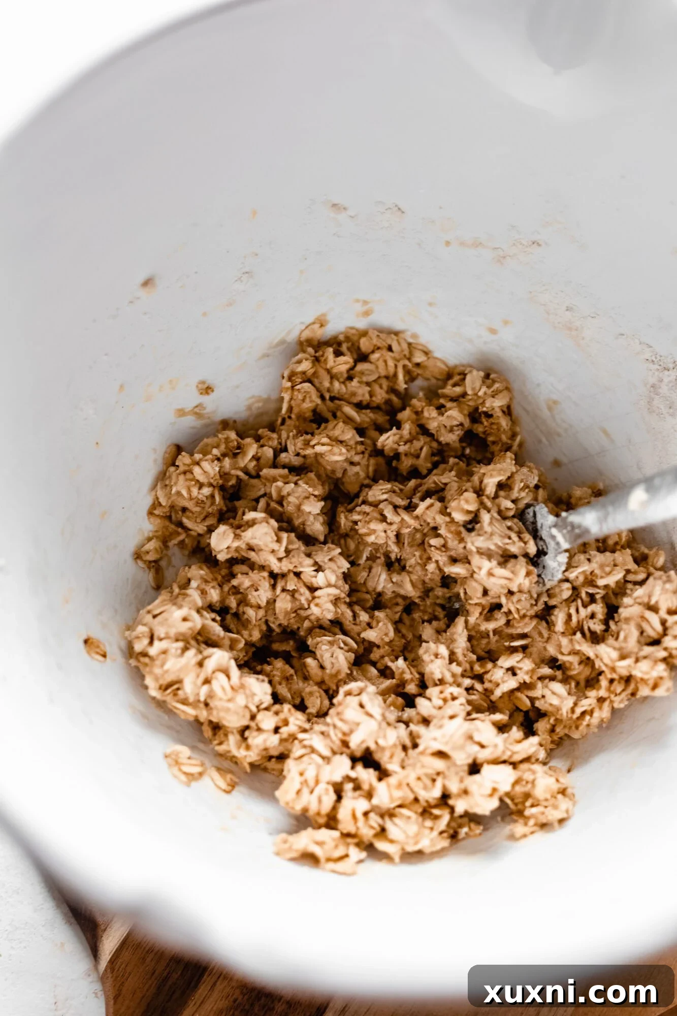 Oat crumble ingredients after wet ingredients are added and mixed, creating a textured batter.