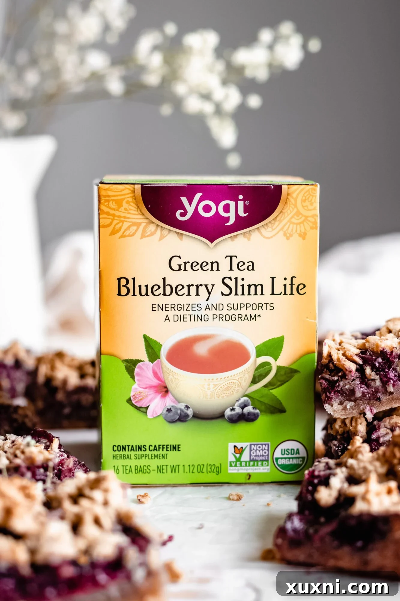 A single, perfectly sliced healthy blueberry crumble bar resting on a plate, ready to be enjoyed.